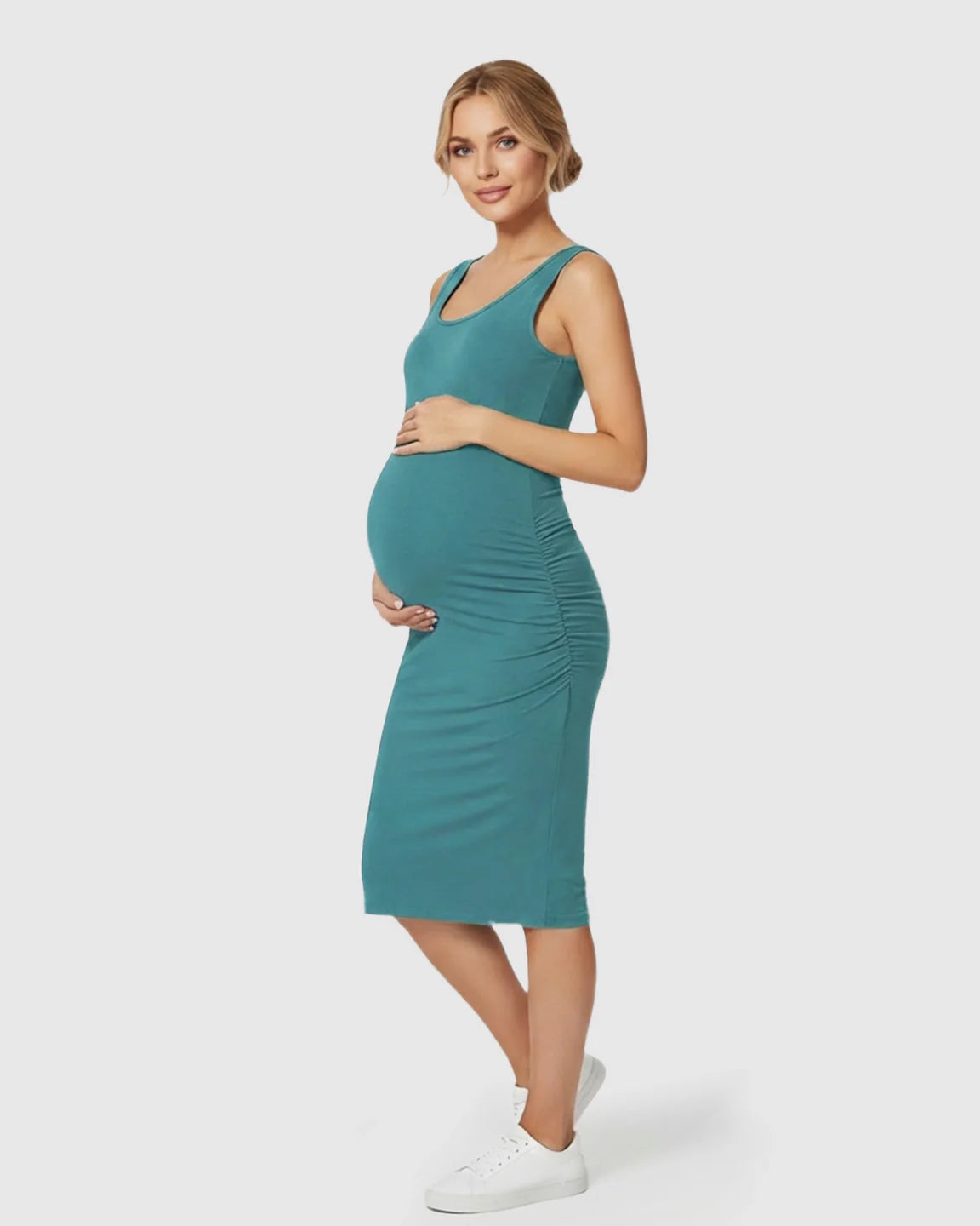 Pregnant woman in a teal sleeveless bodycon maternity dress with side ruching, highlighting her bump.