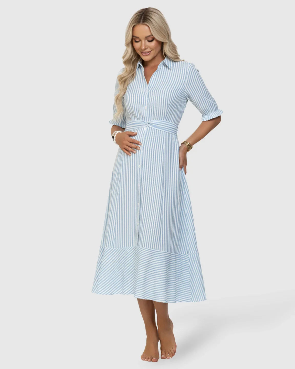 Blonde pregnant woman in a blue and white striped lapel puff-sleeve A-line maternity dress.