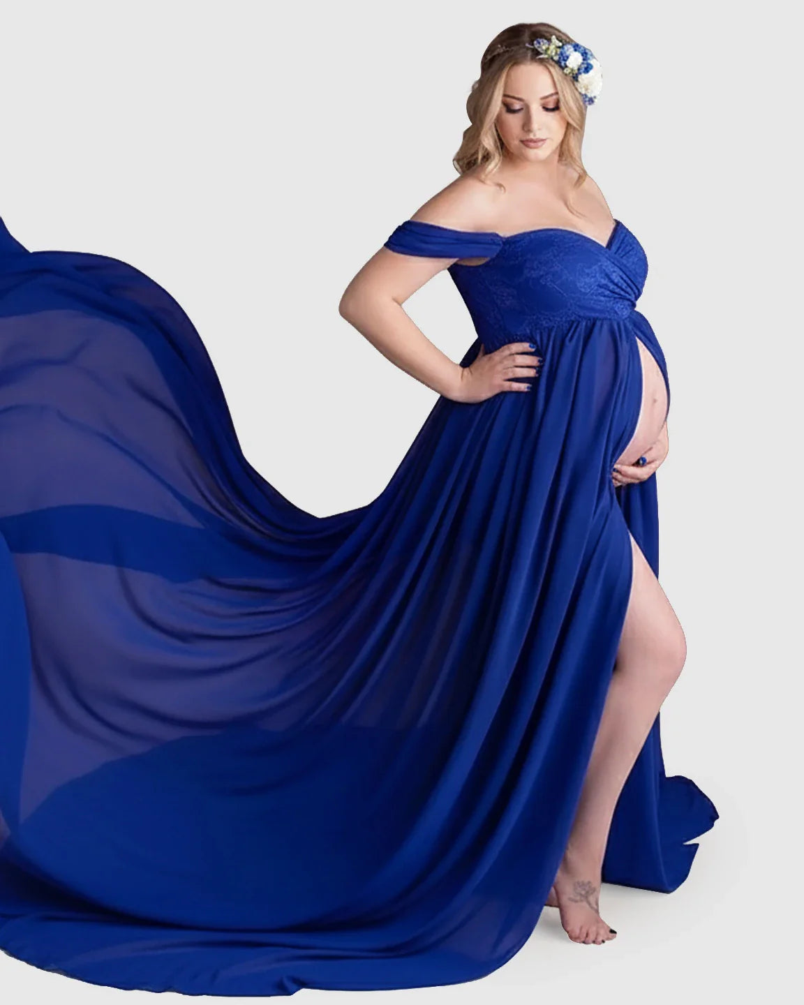 Maternity gown: royal blue off-shoulder chiffon dress with a long train, lace bodice, and high leg slit.