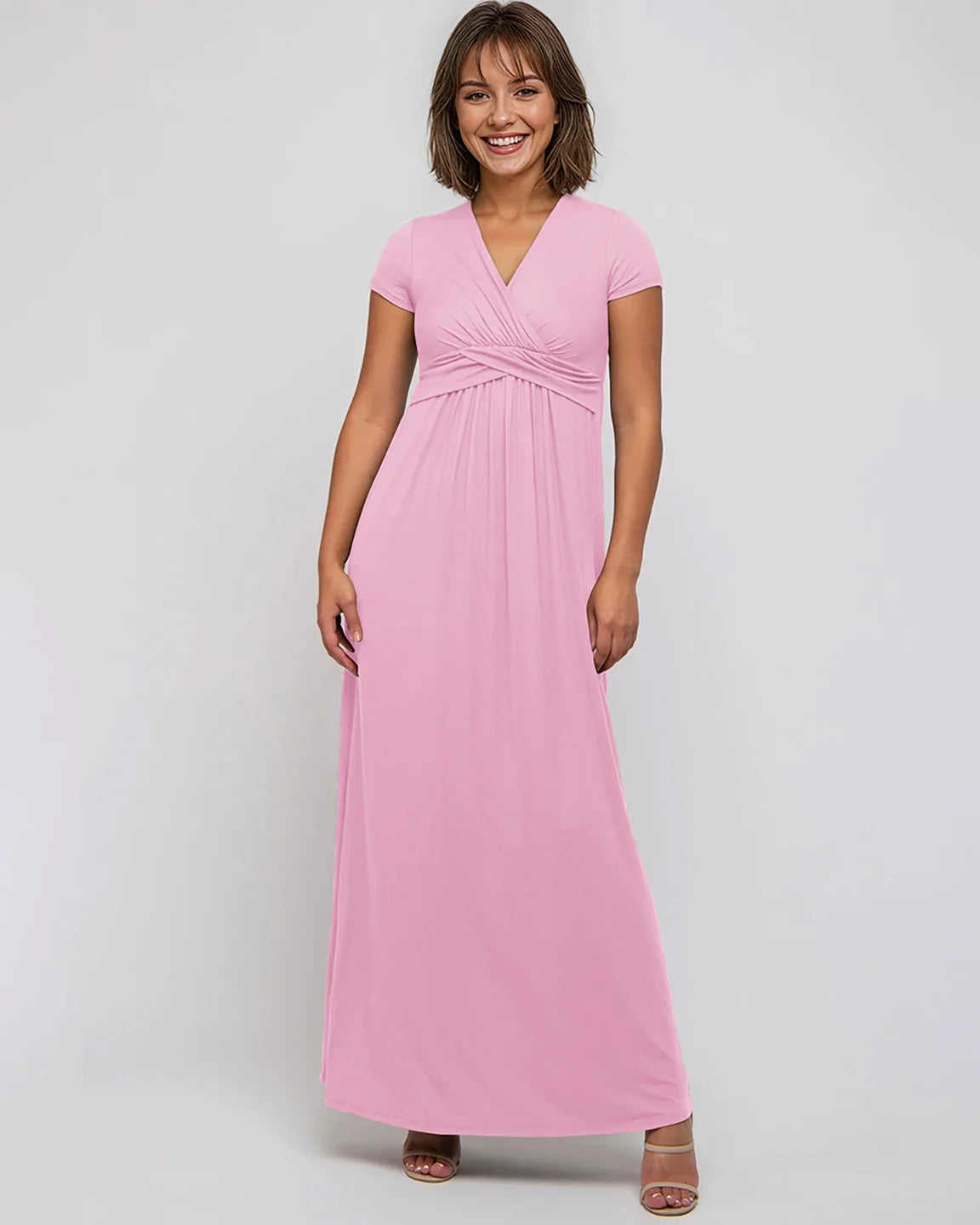 Smiling woman in a pink Twist Front Draped Maternity Nursing Maxi Dress with short sleeves.