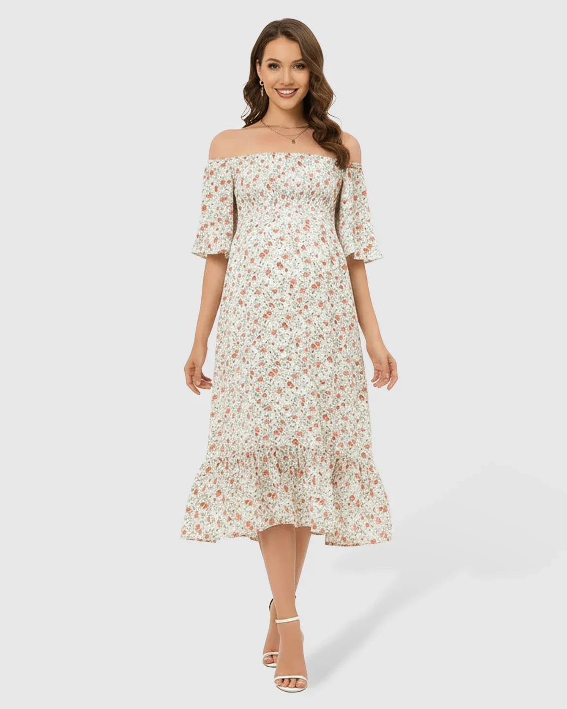 White floral flutter-sleeve smocked maternity midi dress with tiered skirt.