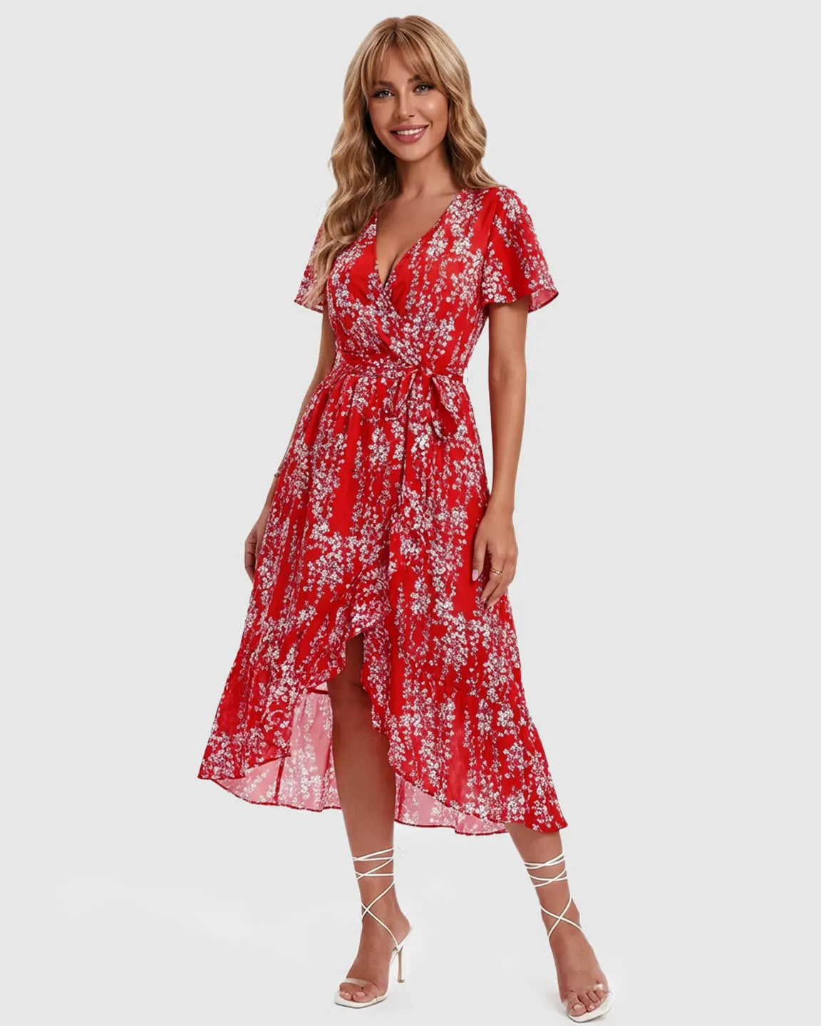 Red floral V-neck ruffled hem maternity midi dress with a tie waist, worn by a smiling model.