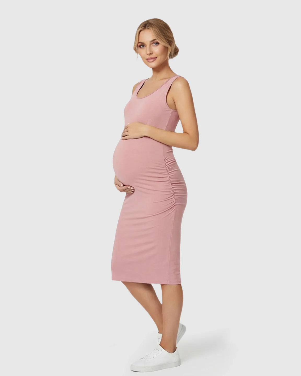 Pink sleeveless bodycon maternity dress with side ruching, worn by a pregnant model.