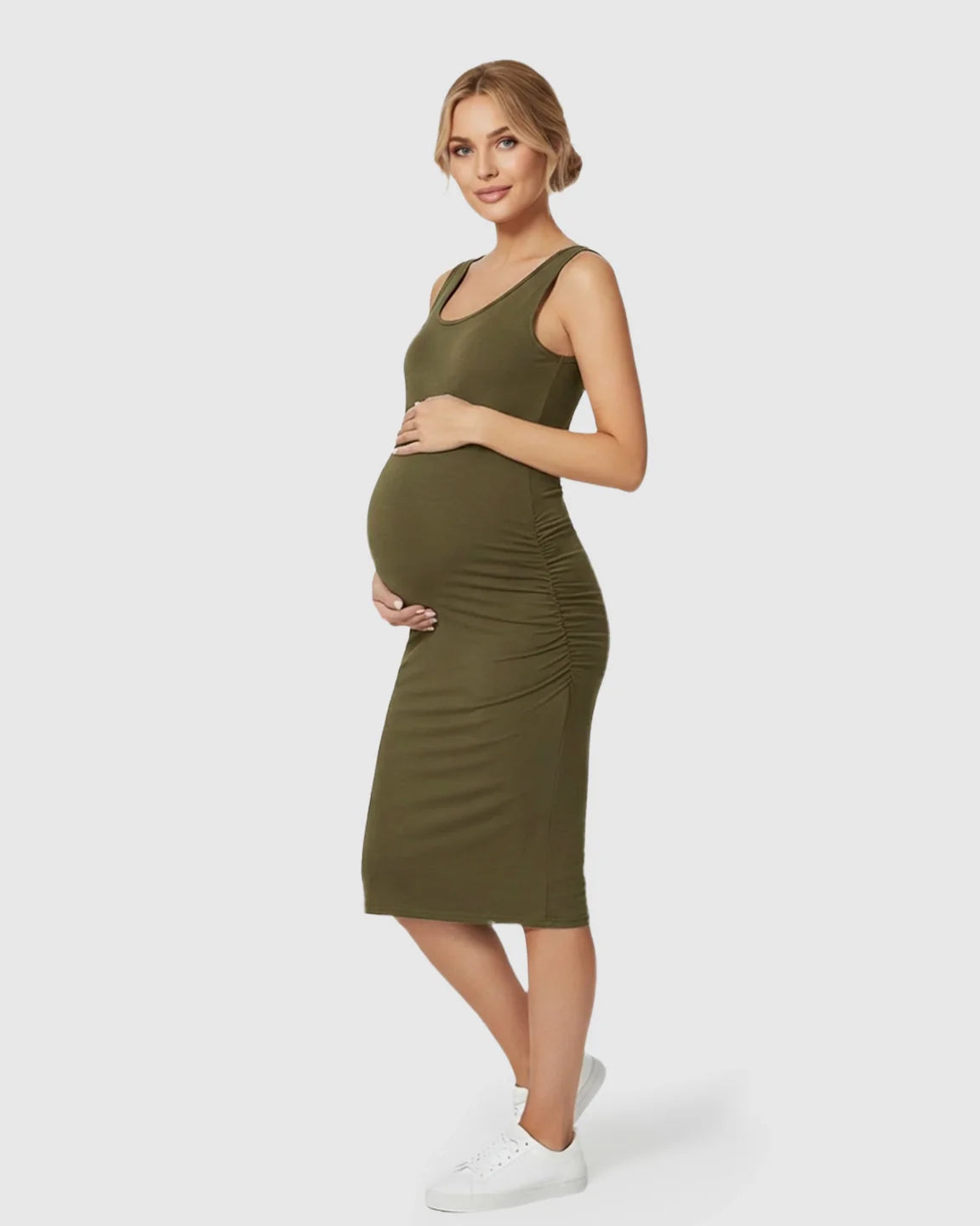 Pregnant woman in an olive green sleeveless bodycon maternity dress with side ruching.