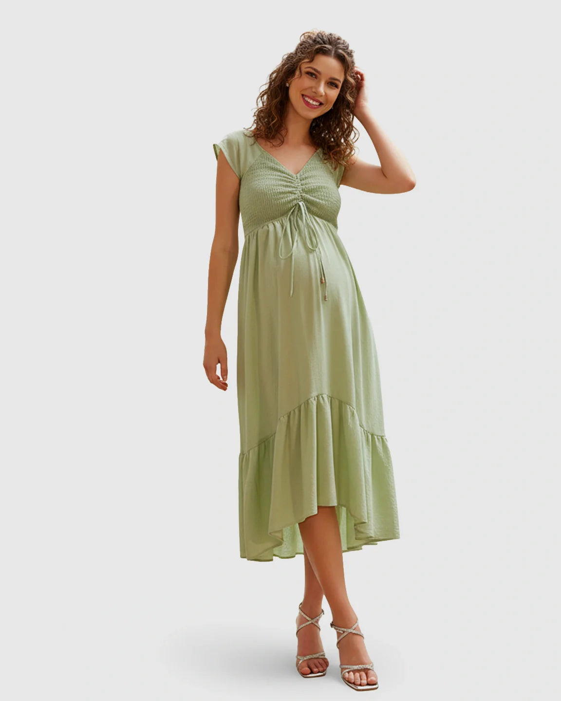 Green smocked-bodice flowy maternity midi dress with cap sleeves, V-neckline, and adjustable drawstring.