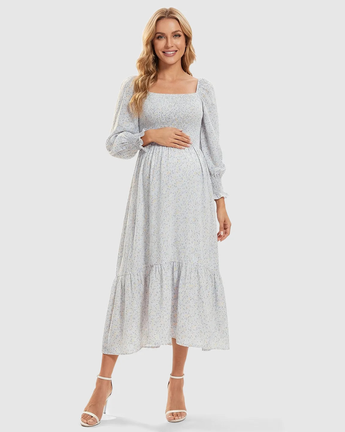 Maternity midi dress with smocked bodice, long sleeves, and a soft floral print.