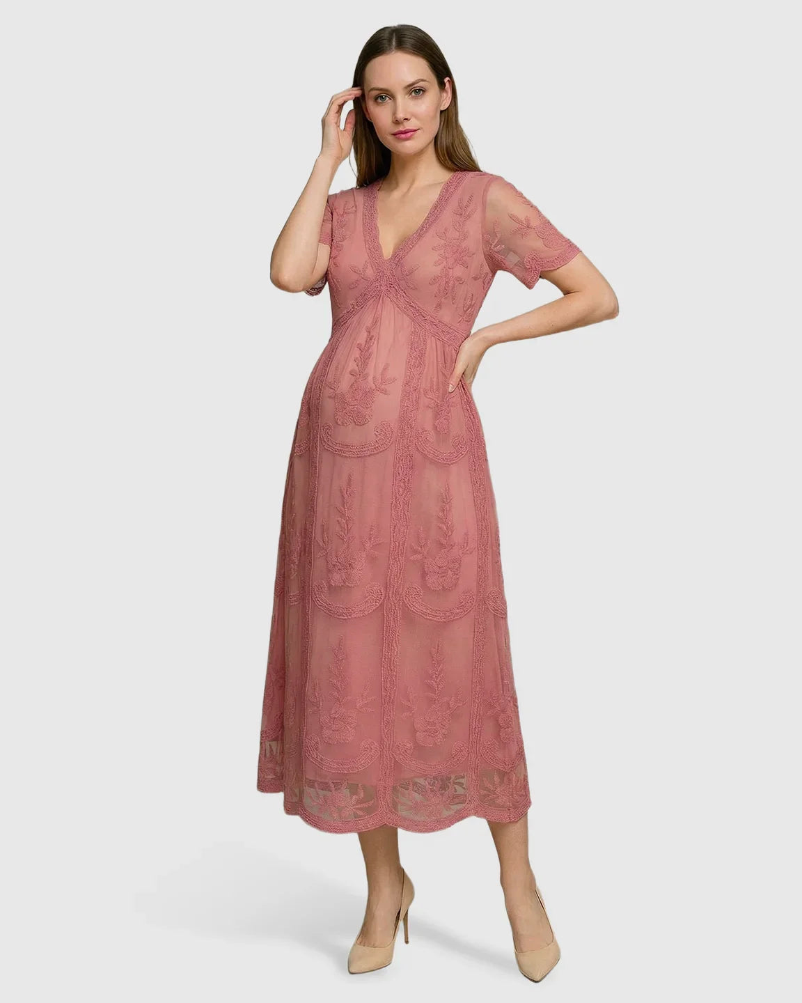 Pink lace maternity midi dress with V-neck, three-quarter sleeves, and swing skirt.