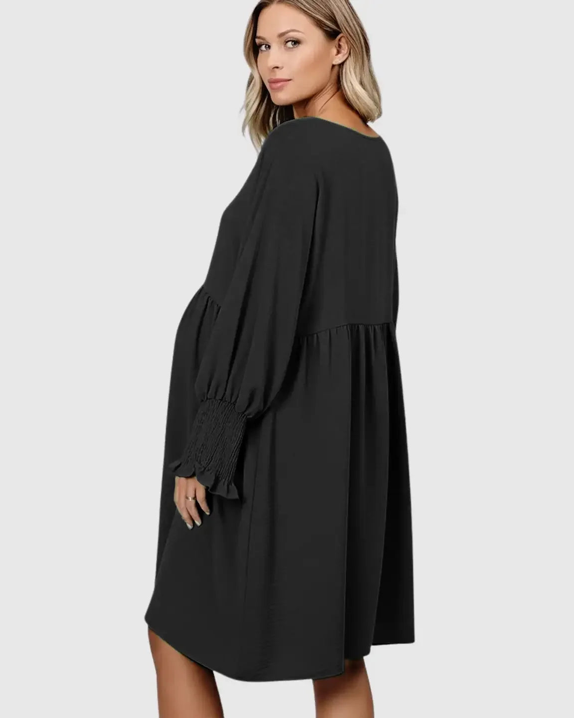 Maternity model in black flowy smocked sleeve casual dress with round neckline, perfect for comfort.