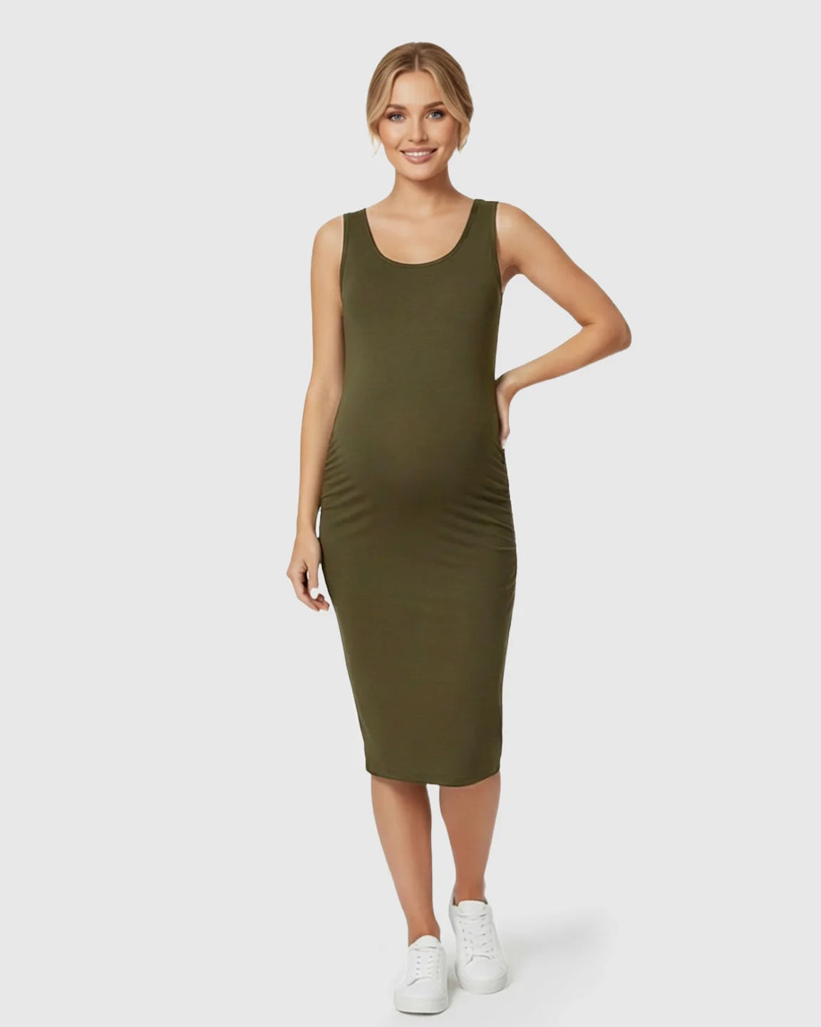 Smiling pregnant woman in an olive green sleeveless bodycon maternity dress with side pleats.
