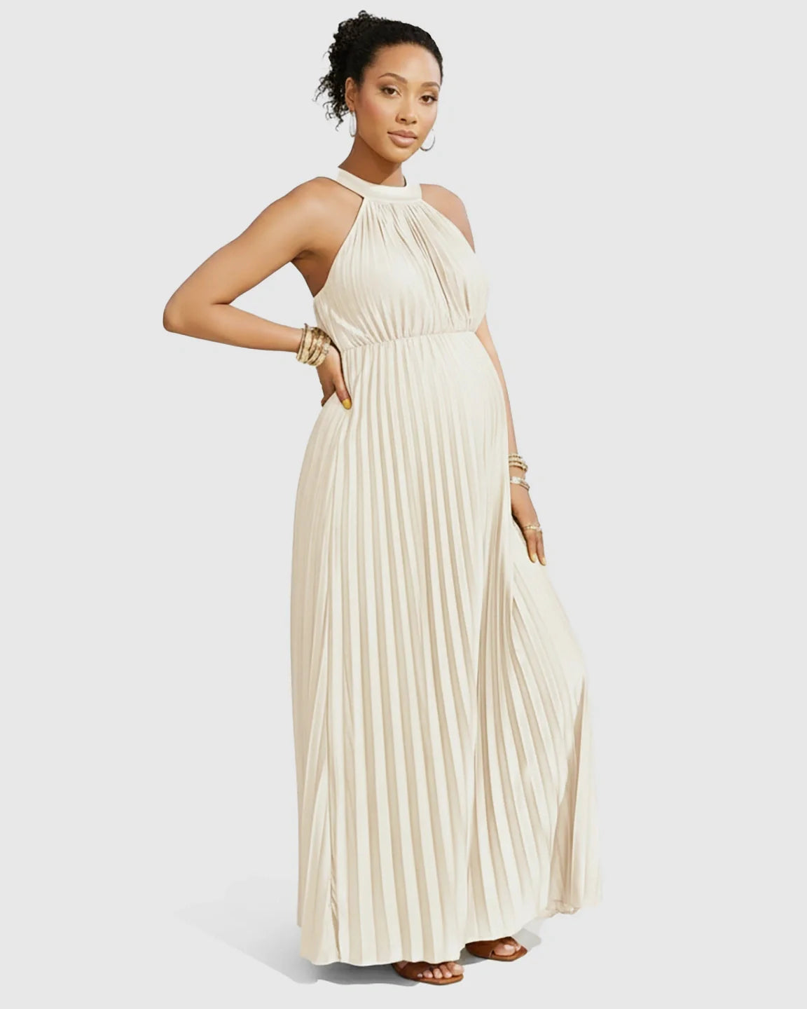 Maternity halter neck pleated maxi dress in light beige faux silk, with a flowing silhouette.