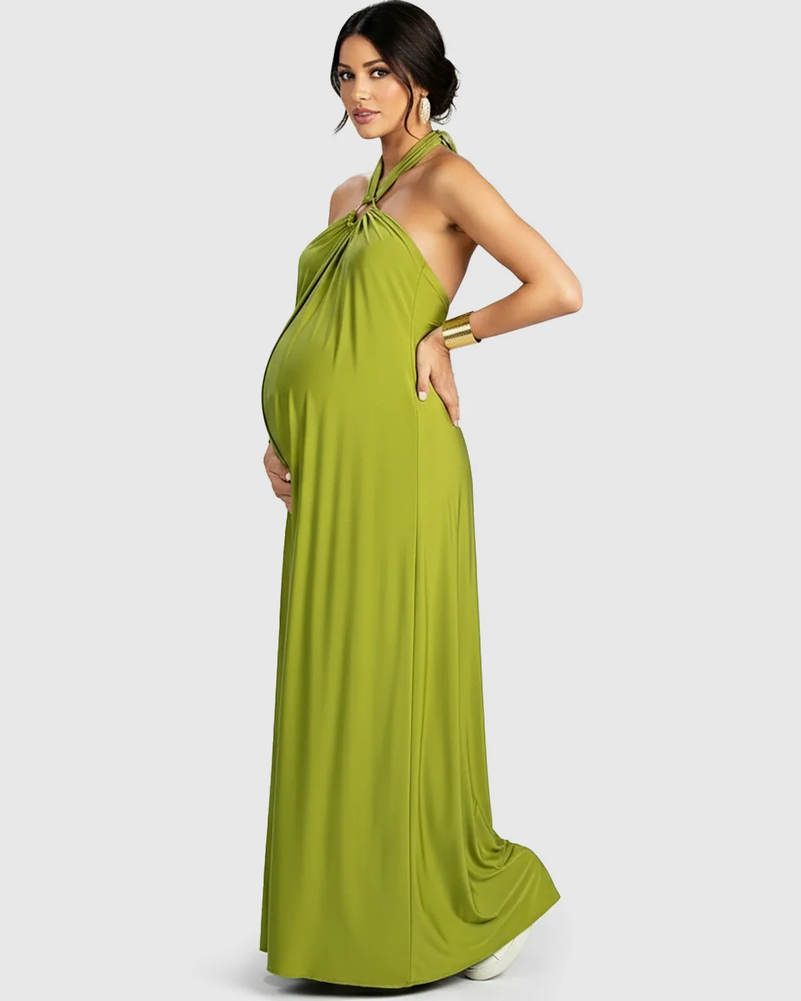 Maternity model in a flowing lime green backless halter neck chiffon maxi dress.