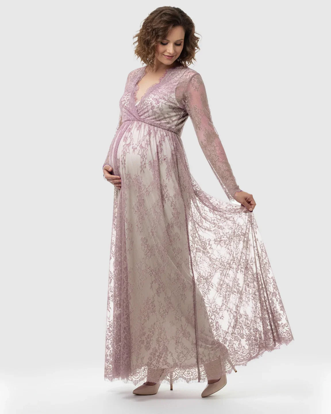 Maternity maxi dress in sheer floral lavender lace with an empire waist and long sleeves.