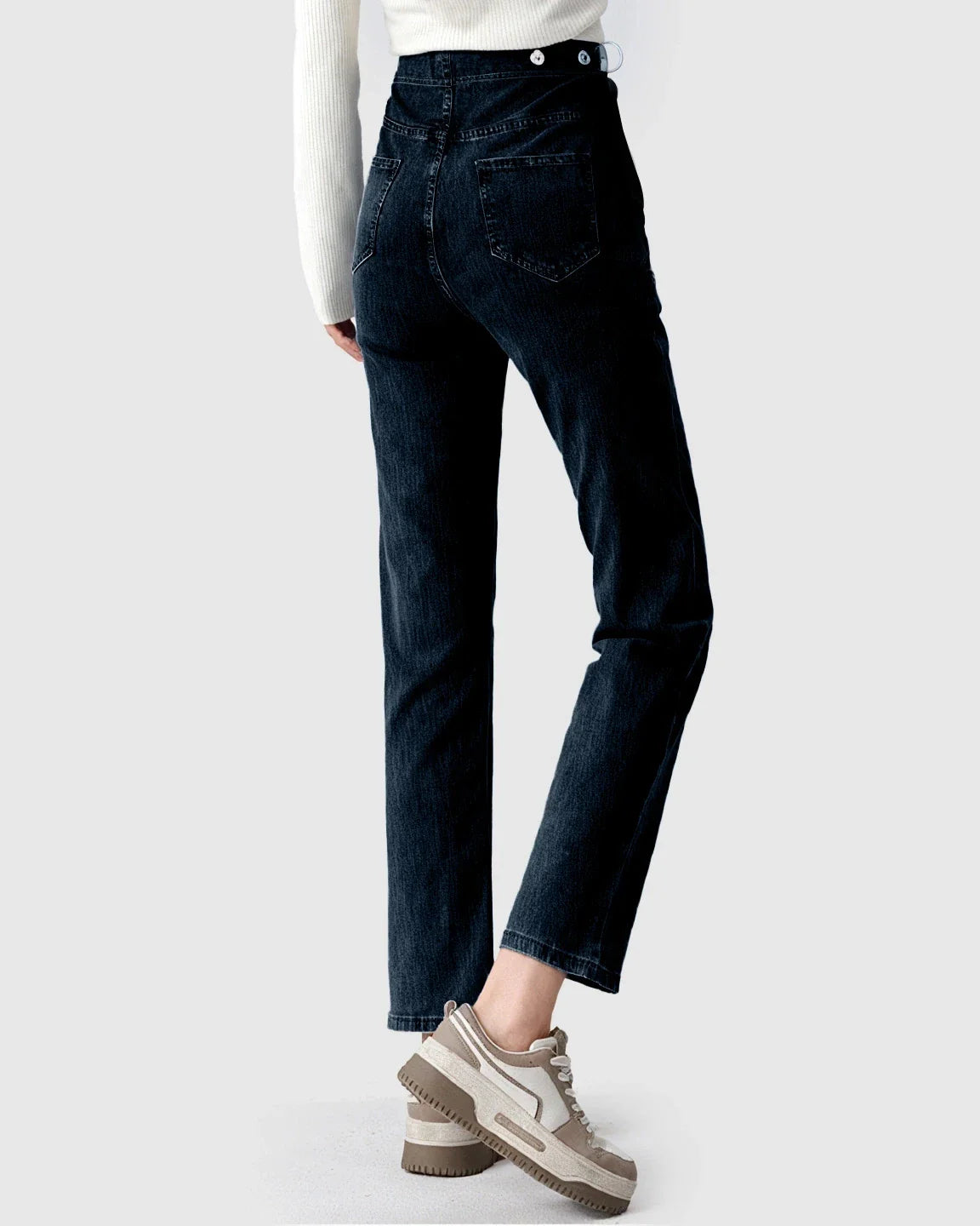 Dark wash stretch denim straight-leg maternity jeans with a high waist and button details, worn with a white sweater.