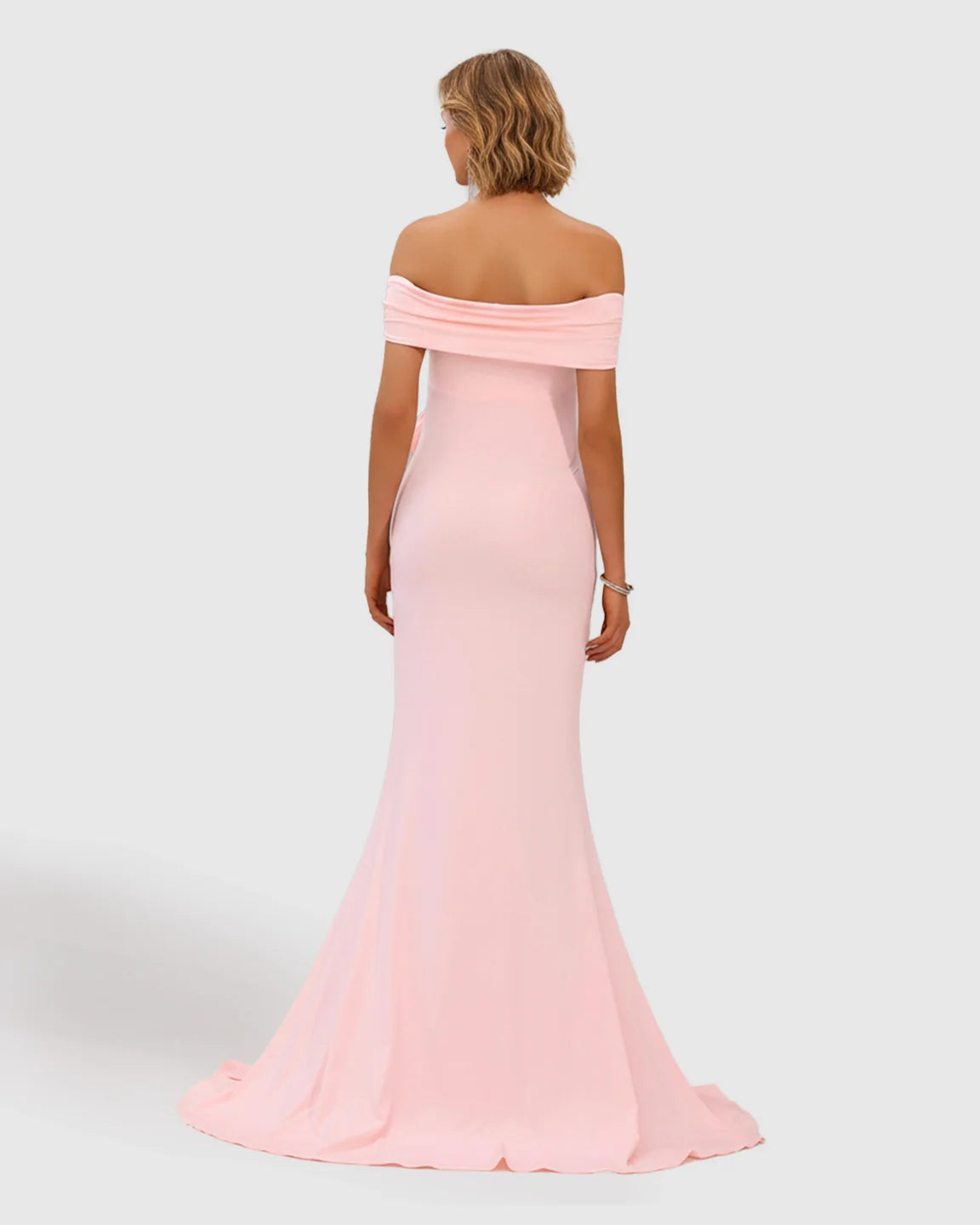 Pink off-shoulder maternity photoshoot gown with a flowing fishtail hem, made from soft, stretchy draped chiffon.