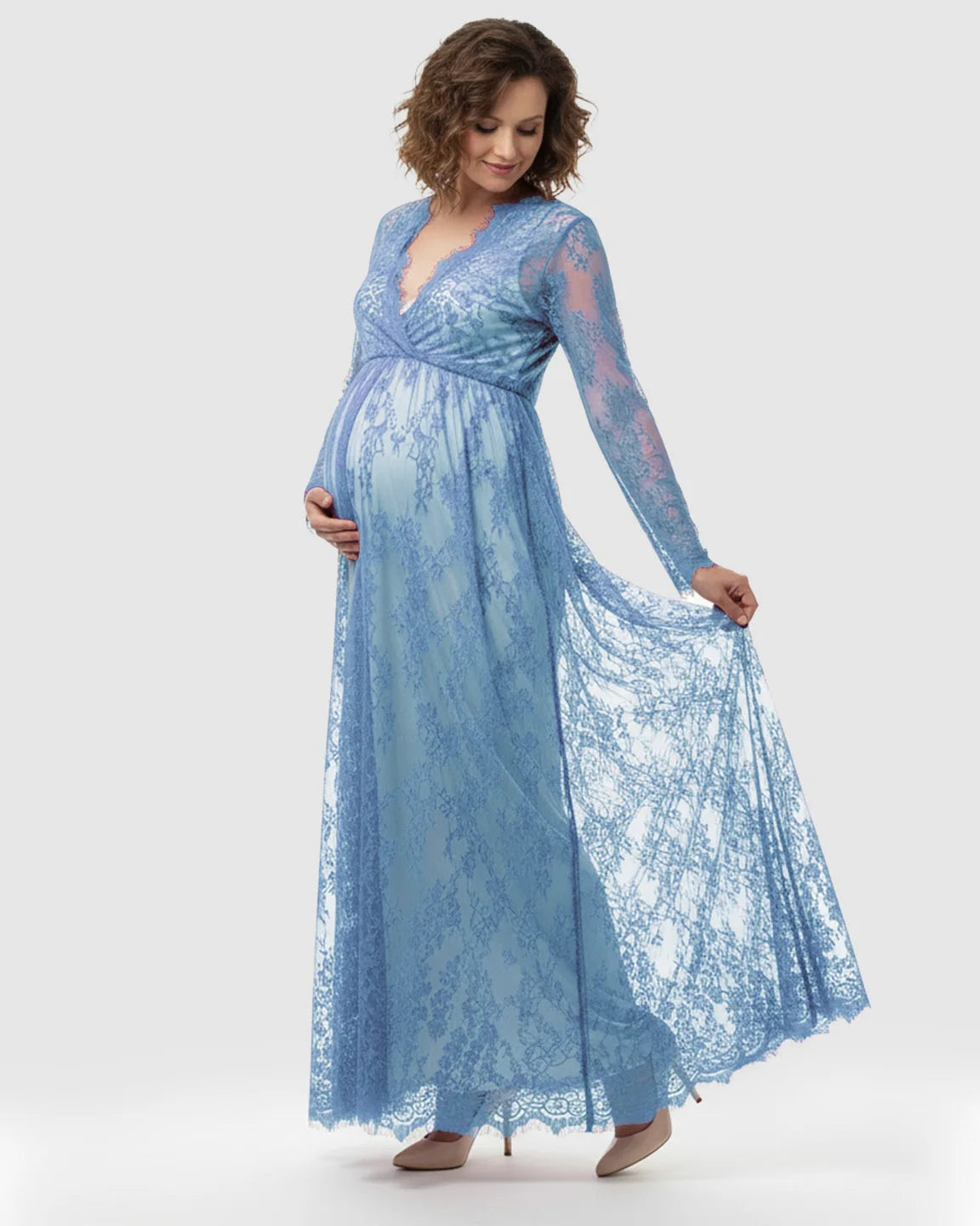 Maternity maxi dress in sheer floral blue lace with empire waist, V-neck, and long sleeves.