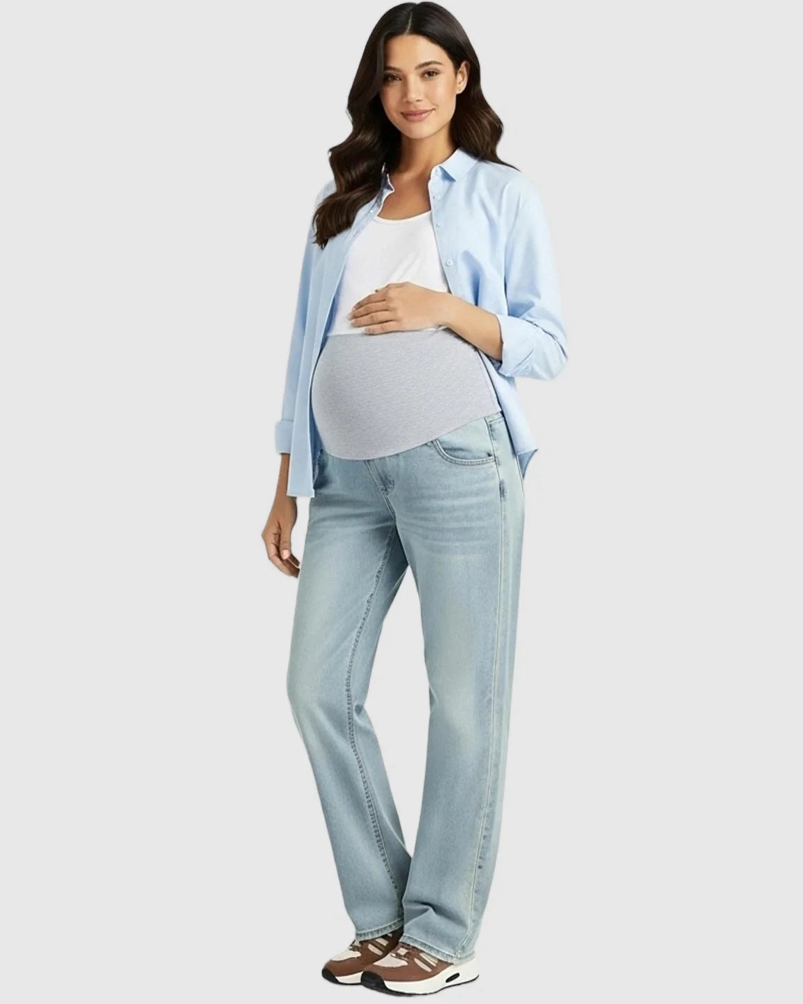 Pregnant woman in light wash, straight-leg maternity jeans with a gray belly band, white tank, and blue shirt.