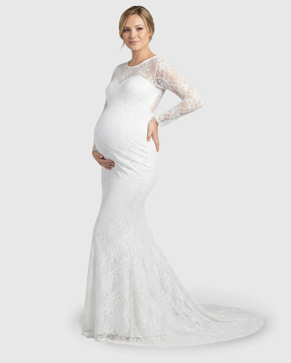 White sheer lace trumpet maternity photoshoot gown with long sleeves and mermaid skirt.
