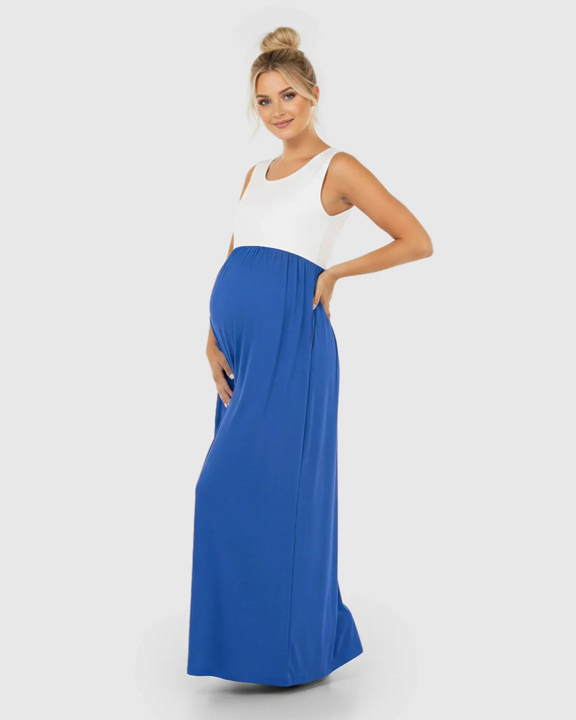 Maternity maxi dress: white sleeveless top, blue high-waisted flowing skirt, round neck.