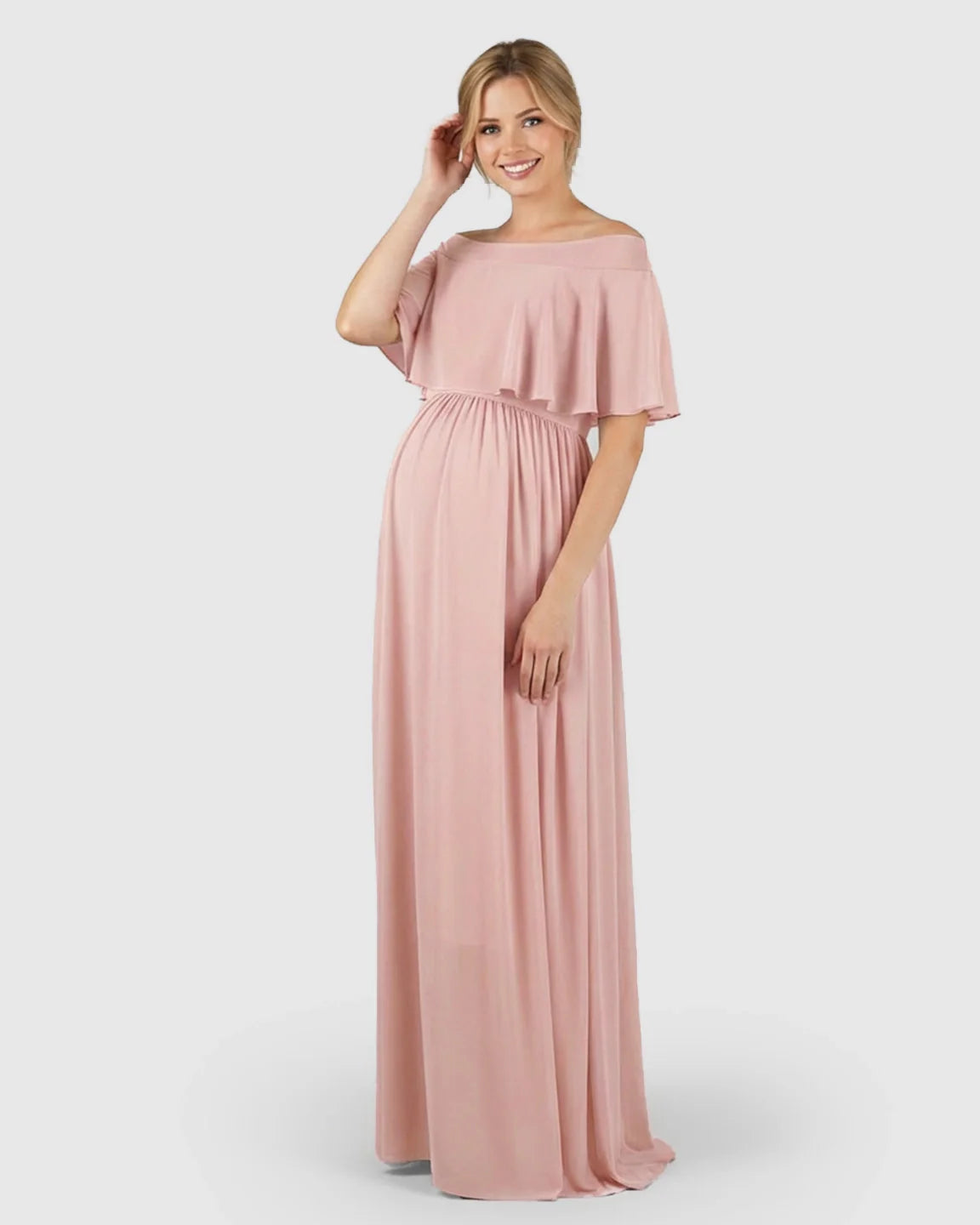 Blush pink off-shoulder chiffon maternity photoshoot dress with a ruffled bodice and flowy silhouette.