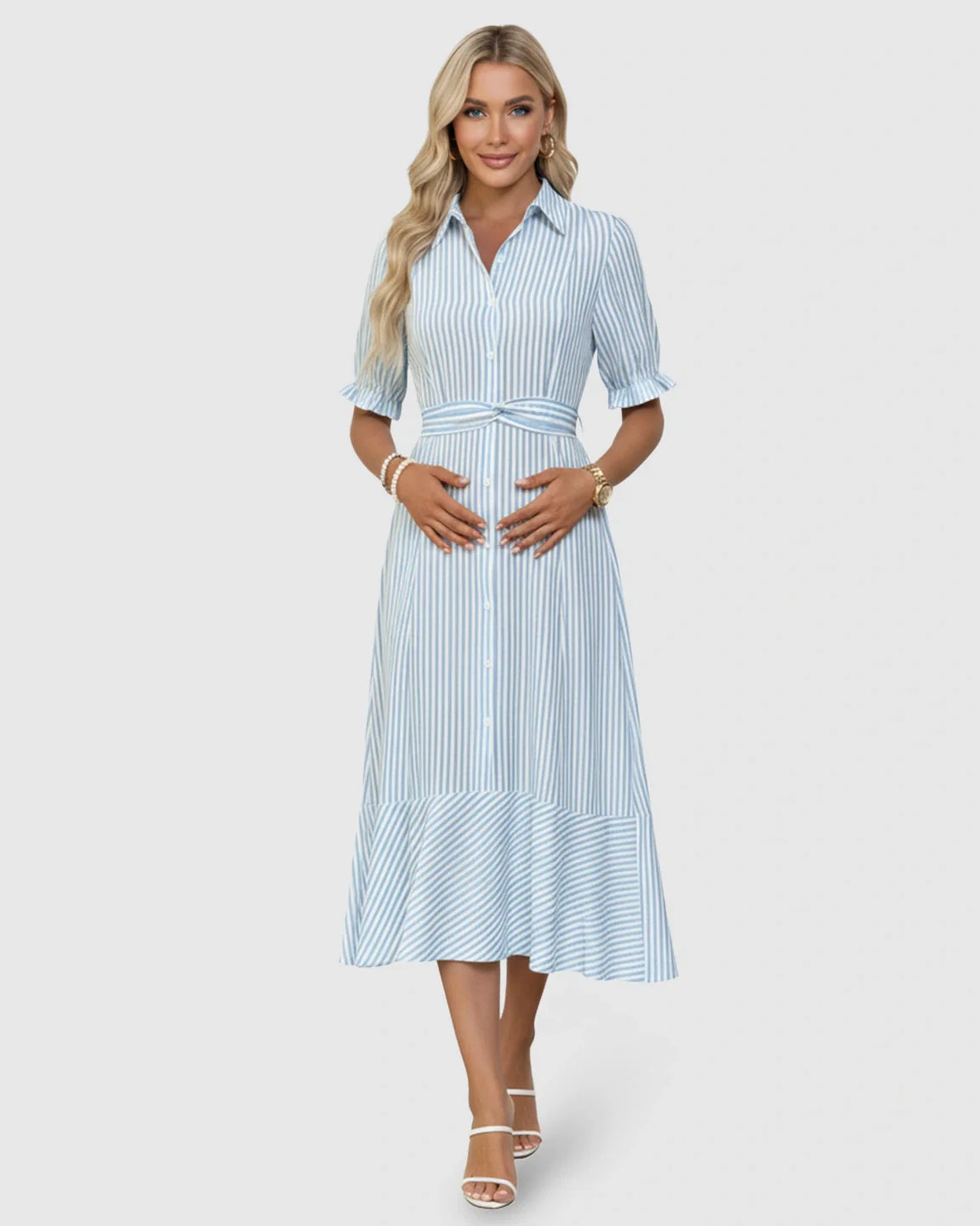 Smiling pregnant woman in a blue and white striped A-line maternity dress with lapel collar and puff sleeves.