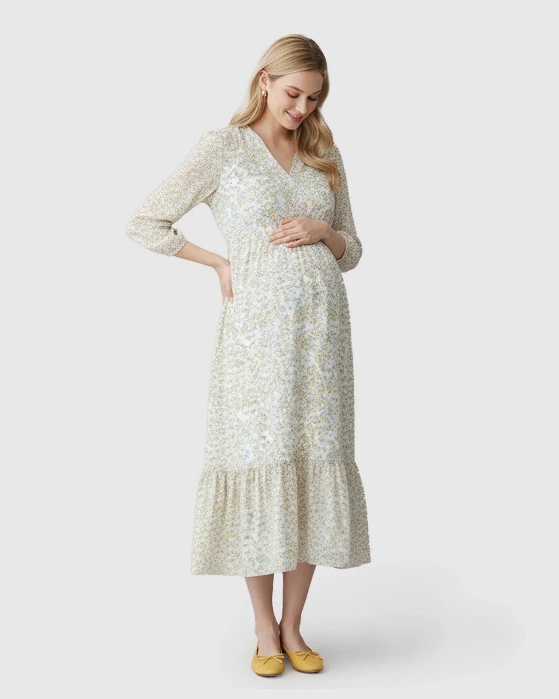 Maternity midi dress with a floral print, smocked waist, V-neck, and tiered ruffle hem.