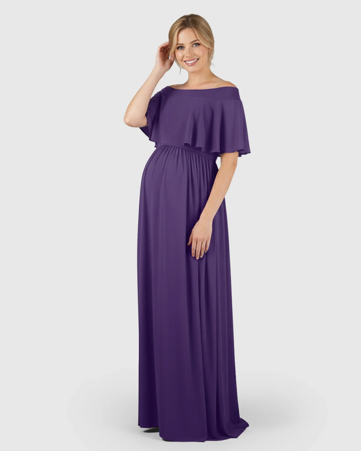 Smiling pregnant woman in a flowing purple off-shoulder bohemian maternity photoshoot dress made of soft chiffon.