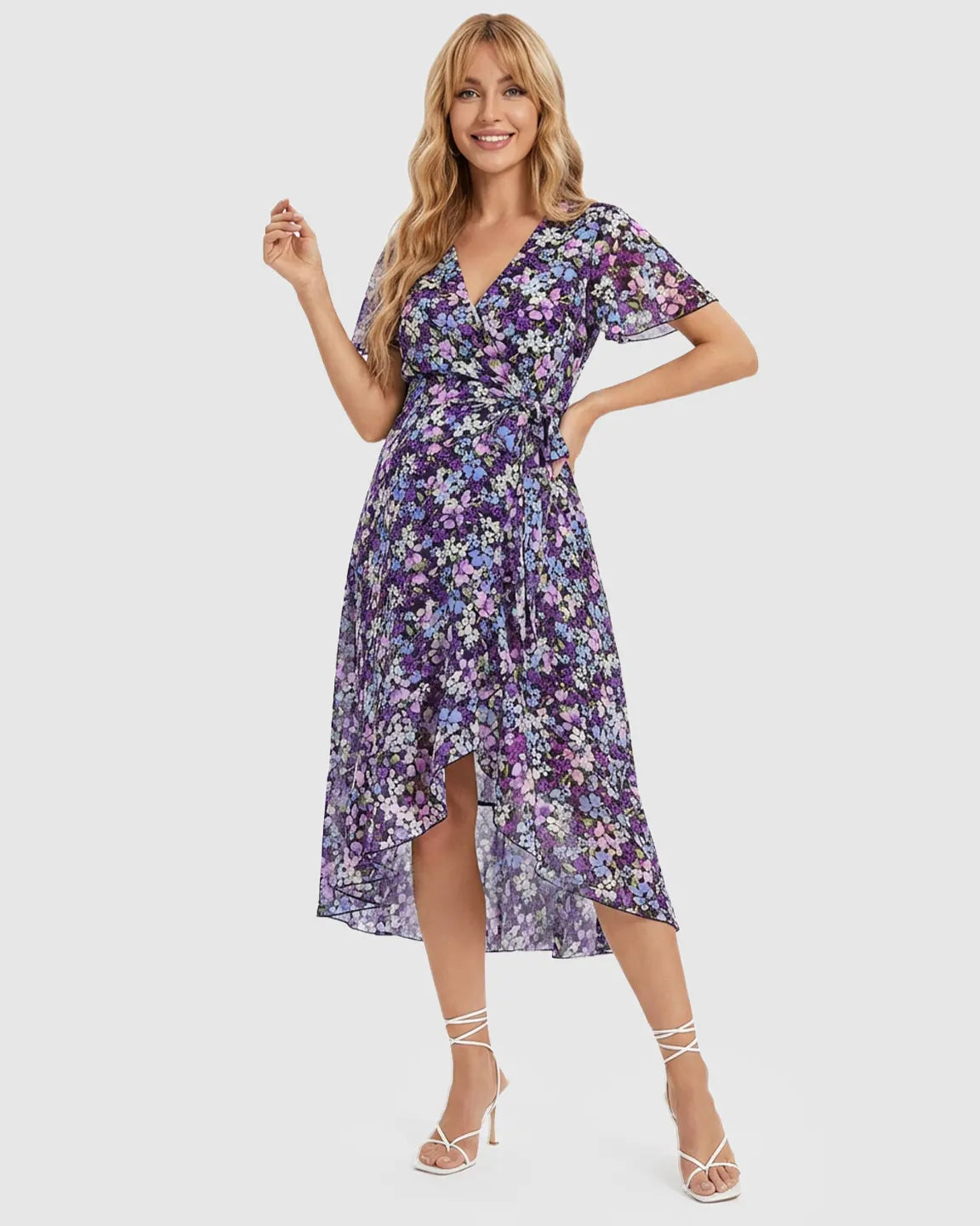 Purple floral V-neck ruffled hem maternity midi dress with short sleeves and a tie waist.