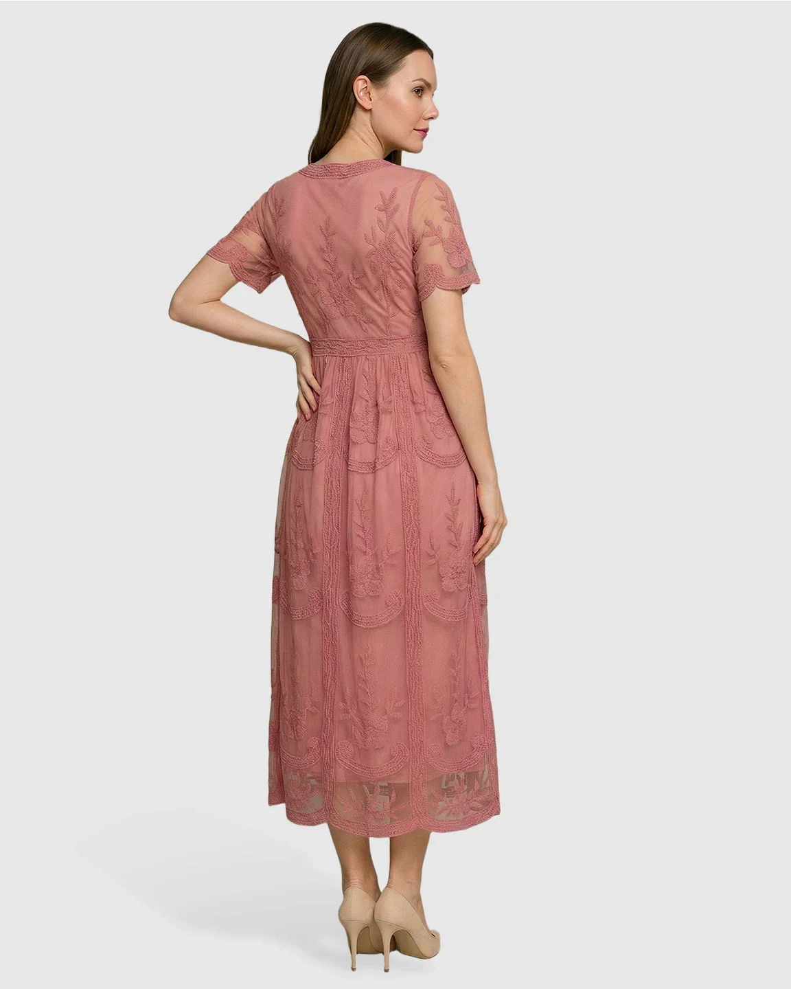Woman in a dusty rose lace maternity midi dress with short sleeves and a swing skirt, viewed from the back.