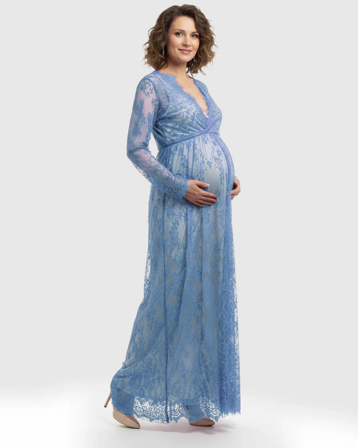 Maternity maxi dress in sheer floral blue lace with an empire waist, V-neck, and long sleeves.
