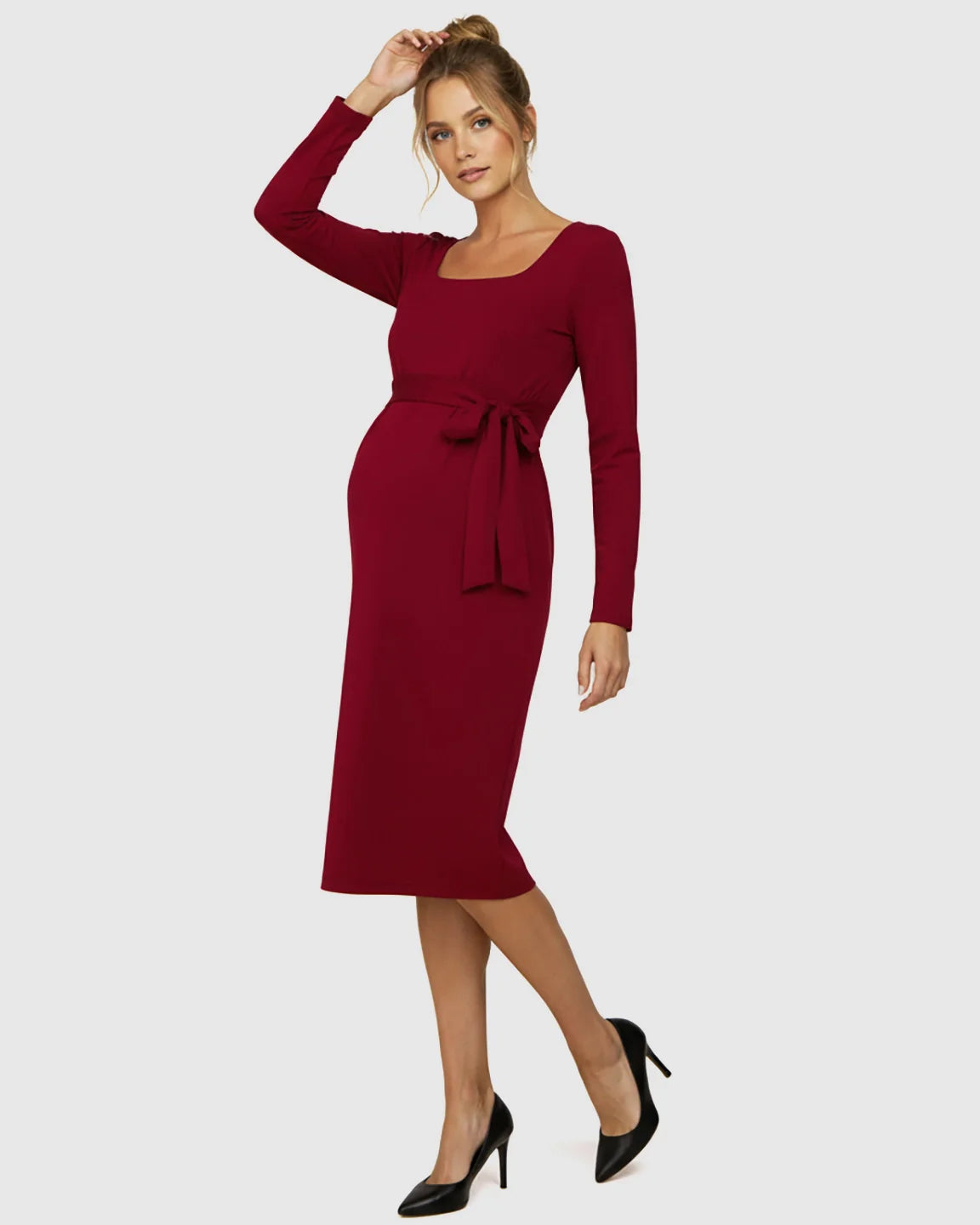 Red square neck long-sleeve maternity midi dress with adjustable side-tie, worn by a pregnant model.