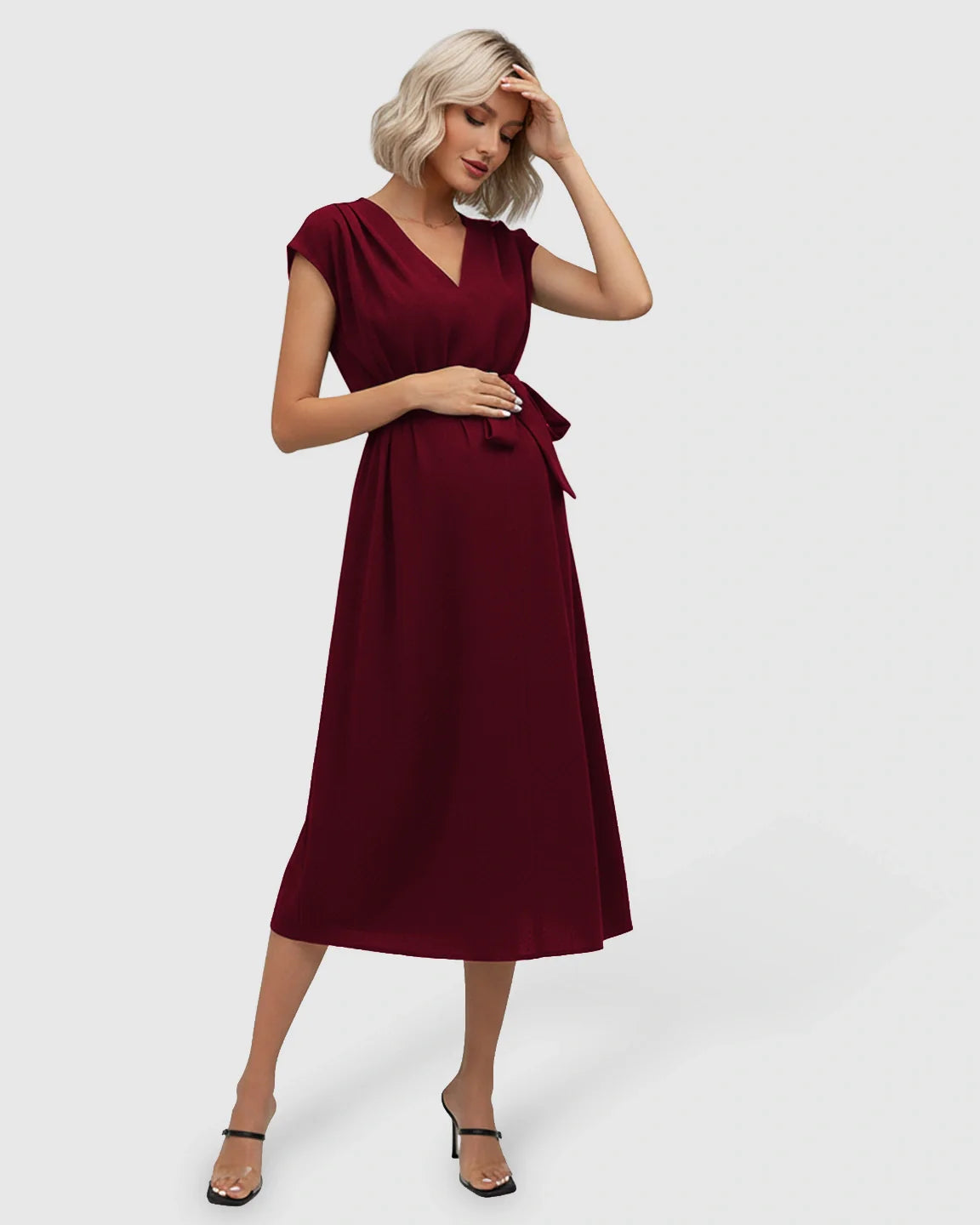 Maternity midi dress in burgundy with V-neck, flutter sleeves, and adjustable tie-waist.