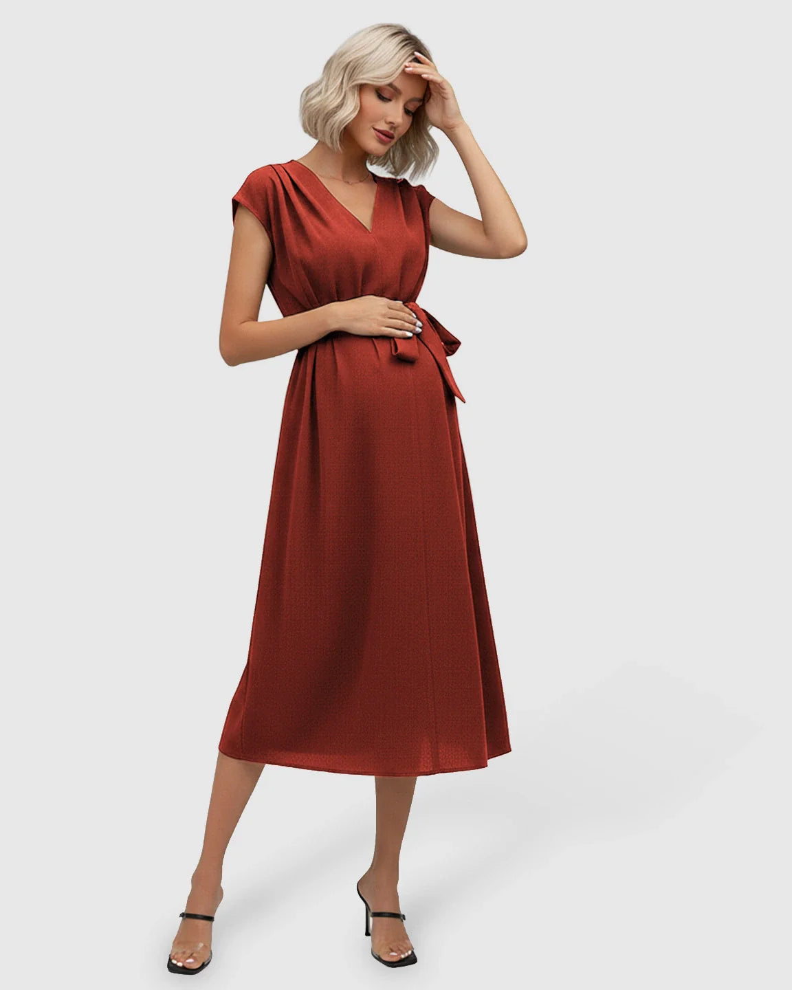 Maternity midi dress in rust, featuring a V-neck, flutter sleeves, and adjustable tie-waist.