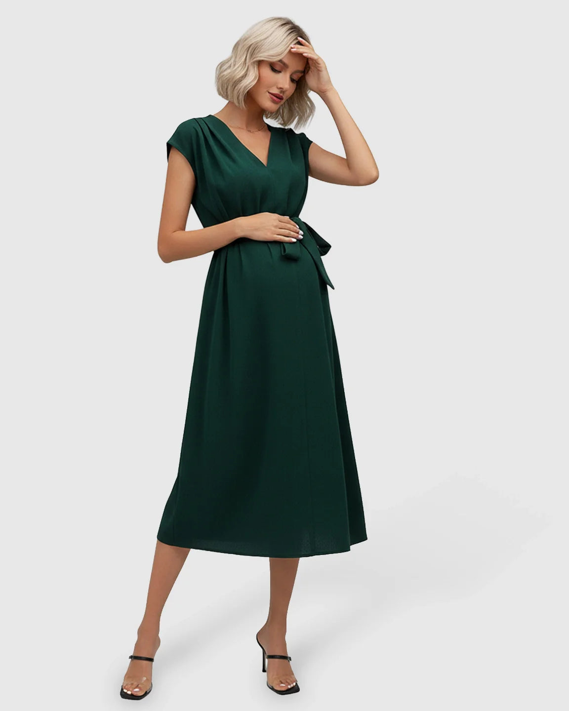 Maternity midi dress in dark green with V-neck, flutter sleeves, and adjustable tie-waist.