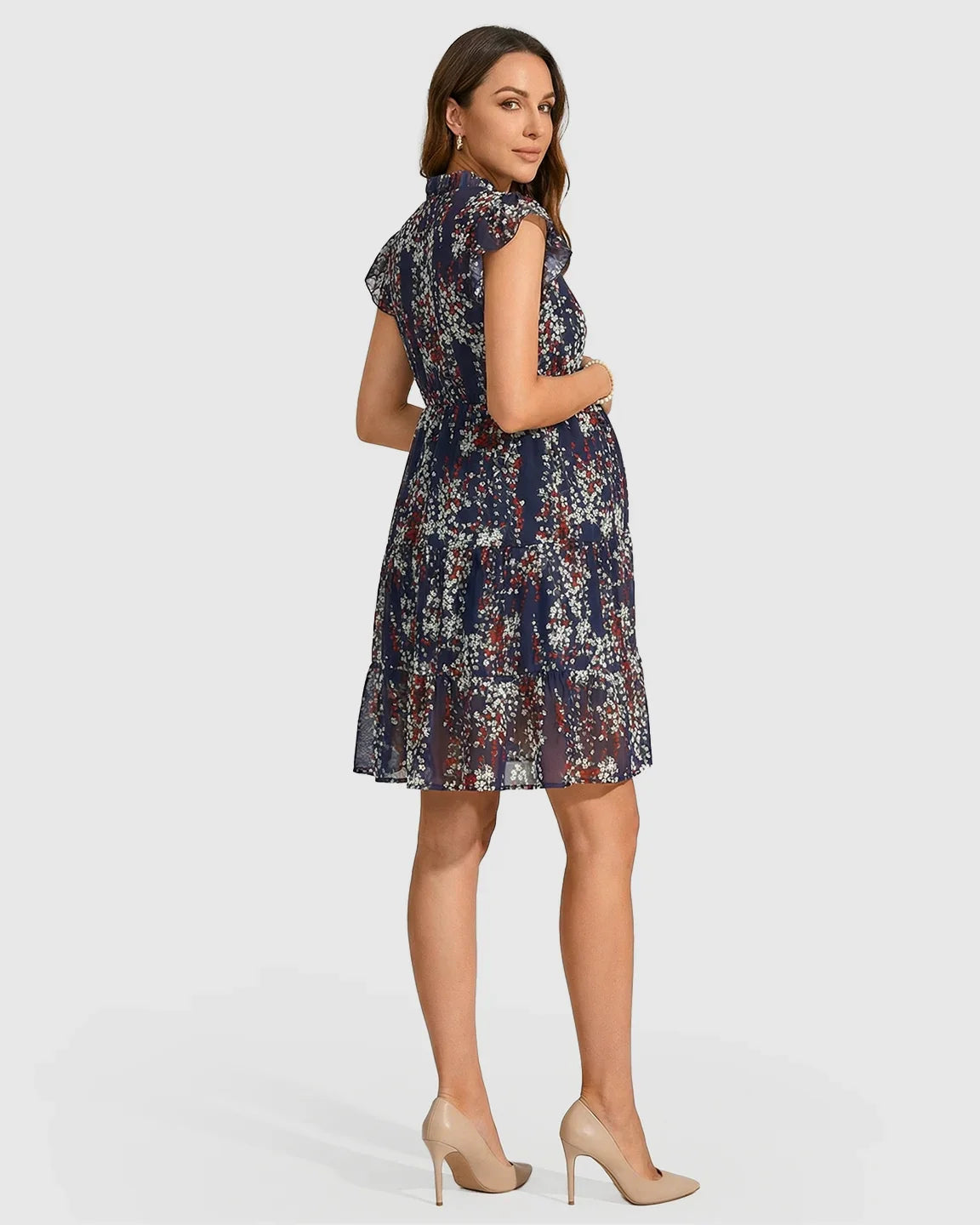 Navy chiffon maternity dress with flutter sleeves, a high neck, and a delicate red and white floral print.