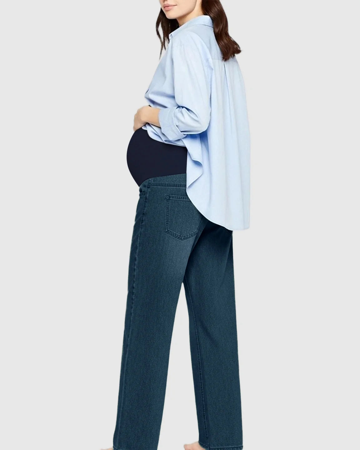 Pregnant woman wearing Bump Society Soft Stretch Straight-Leg Maternity Jeans in blue denim with a supportive belly band.
