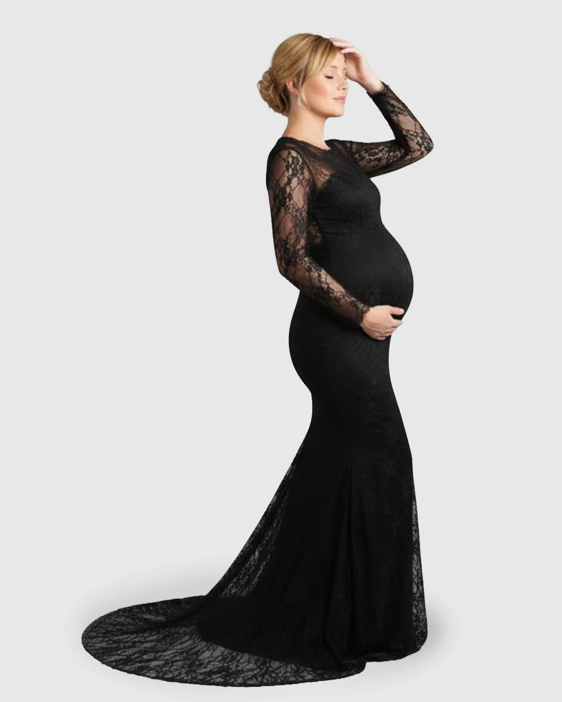 Pregnant model in a black sheer lace trumpet maternity gown with long sleeves and a mermaid-style skirt.