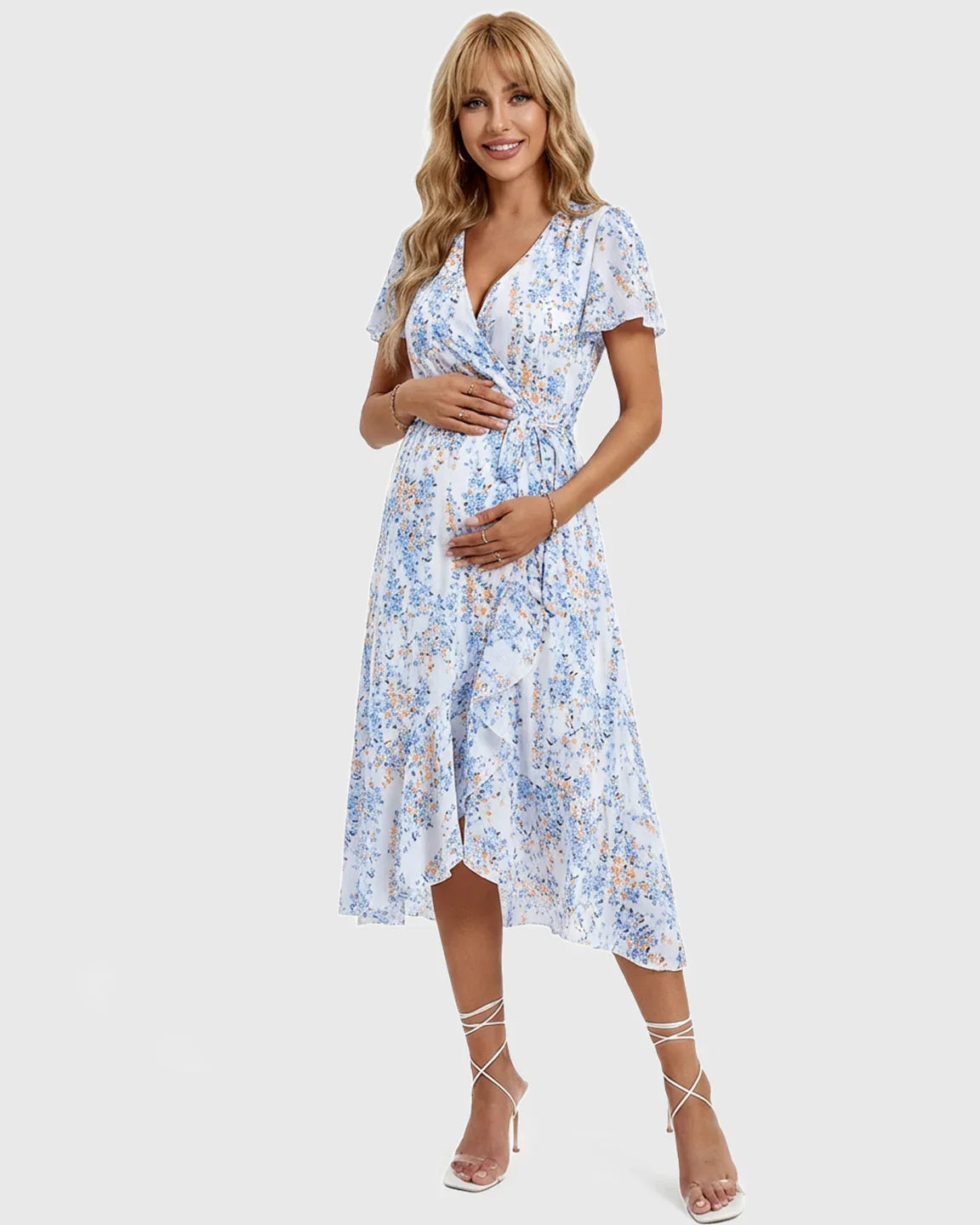 Maternity midi dress: white with blue and orange floral print, V-neck, ruffled hem, short sleeves, wrap style.