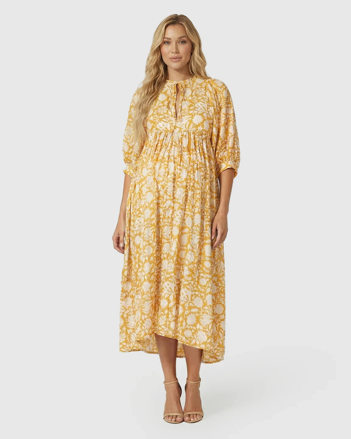 Yellow floral loose fit maternity midi dress with gathered shoulders and puff sleeves.