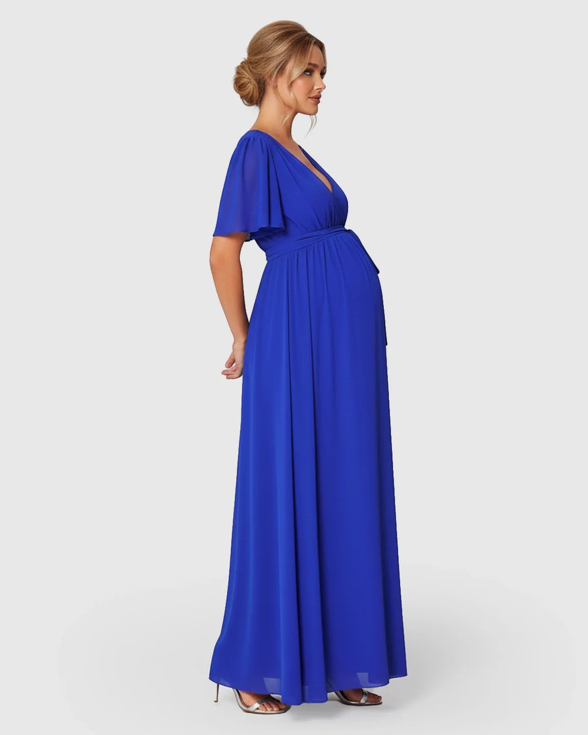 Maternity maxi dress in royal blue with surplice V-neck, flutter sleeves, and empire waist.