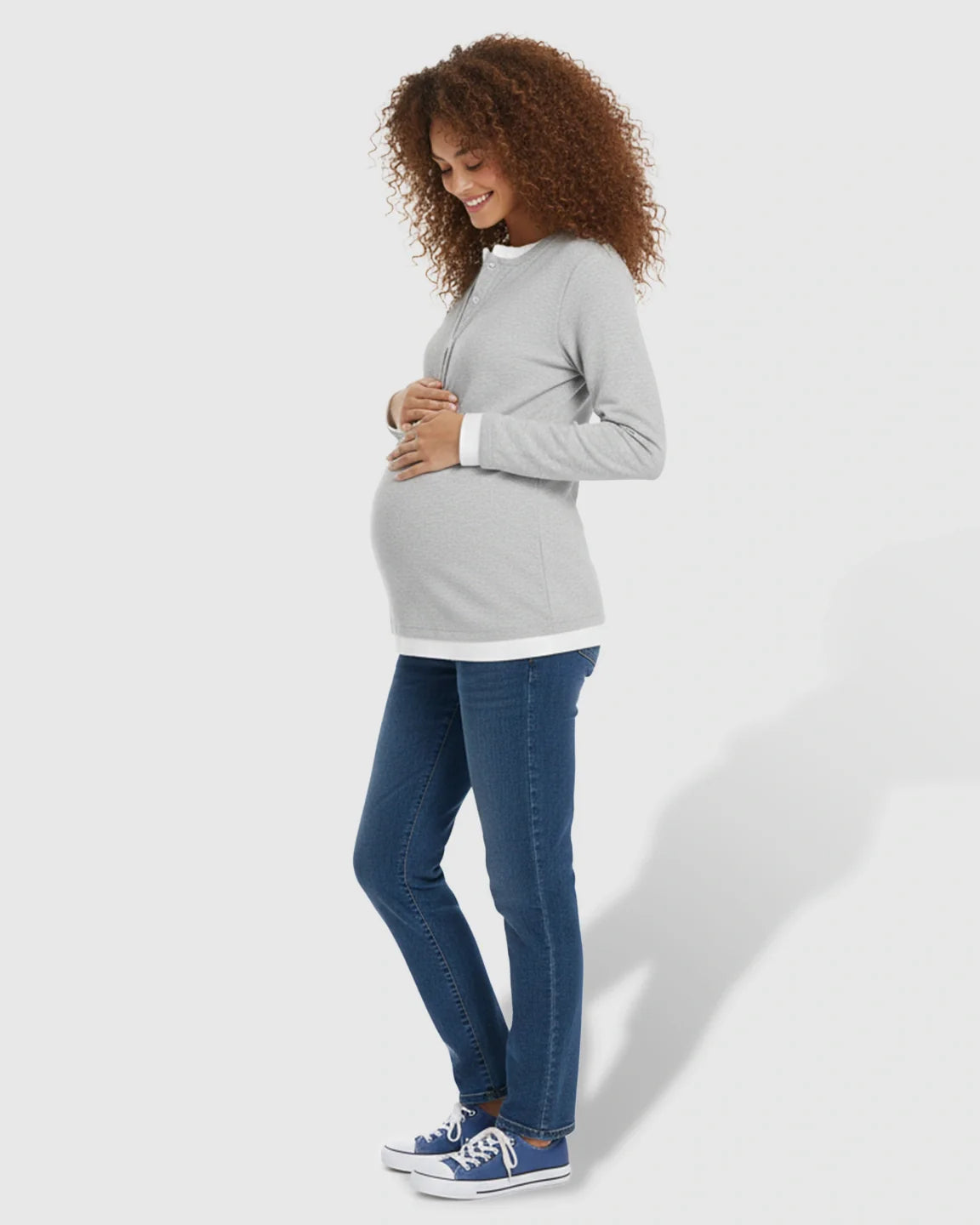 Smiling pregnant woman in a light gray long-sleeve button-front henley maternity and nursing top.
