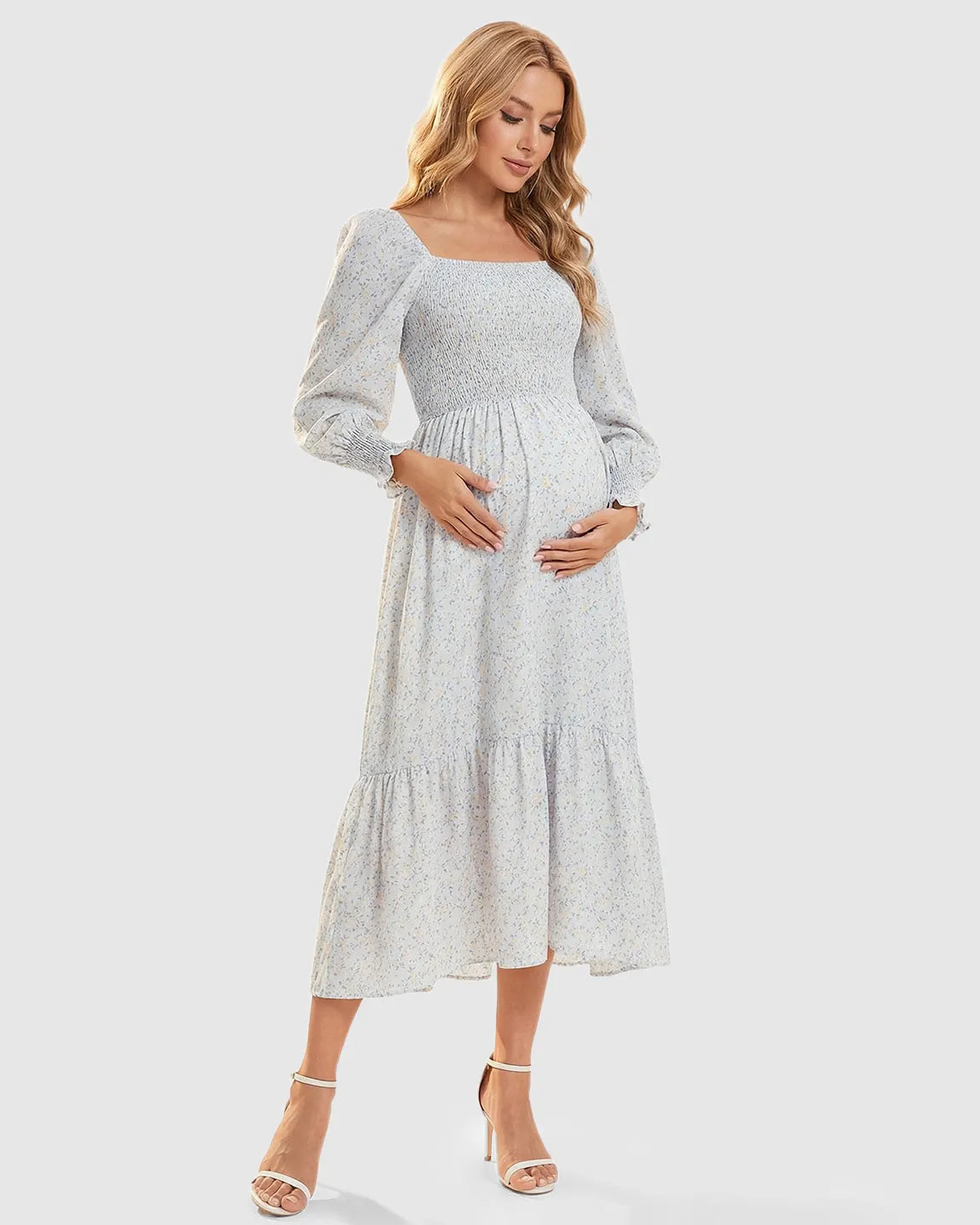 Maternity midi dress with smocked bodice, long sleeves, and a soft floral print.