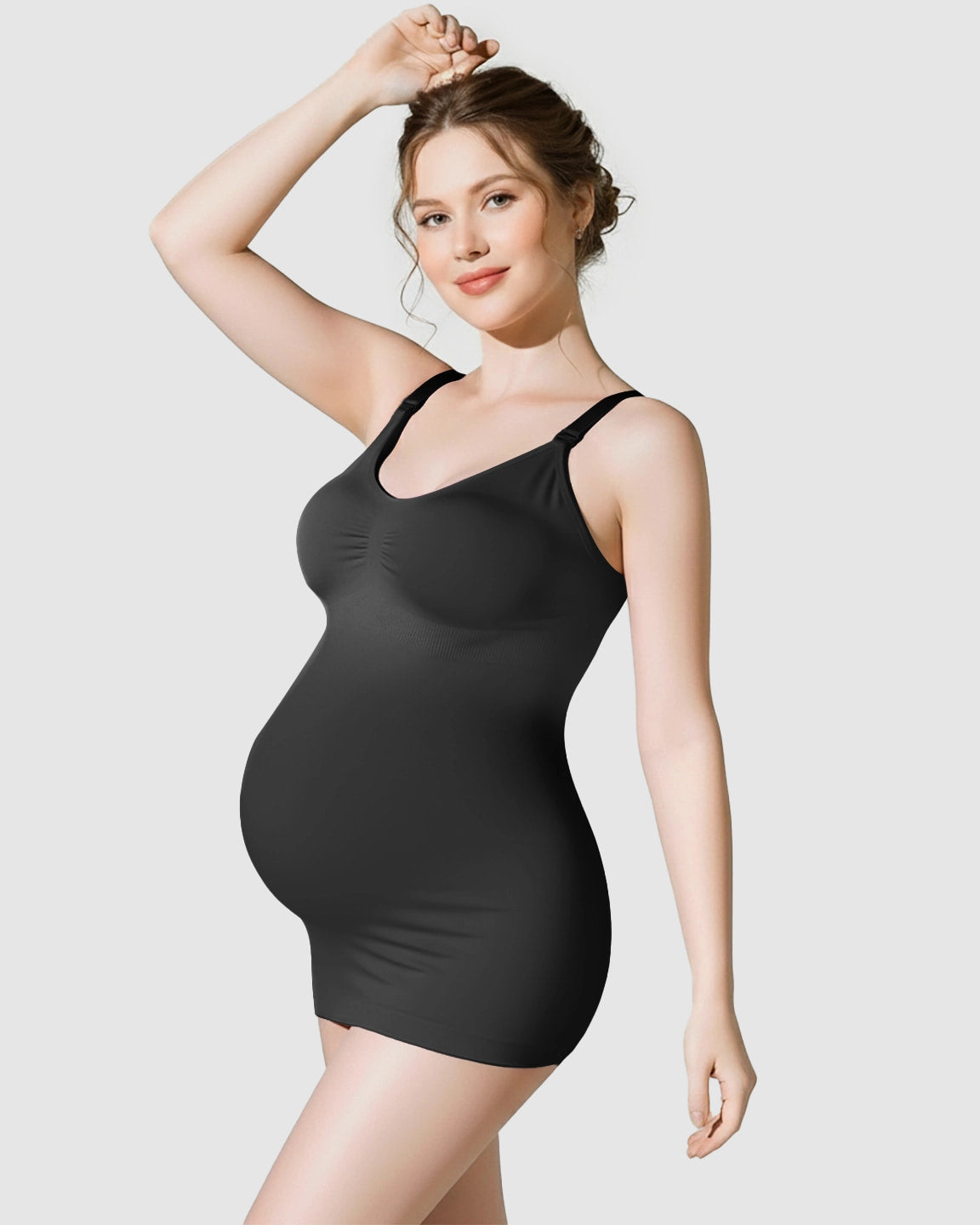 Pregnant woman in a black soft stretch maternity nursing camisole with adjustable straps.