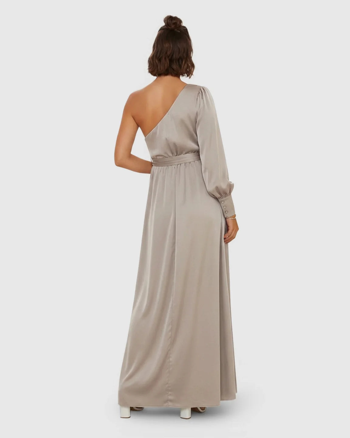 Elegant taupe satin one-shoulder maternity maxi dress with a long sleeve, tie-waist, and flowing silhouette.