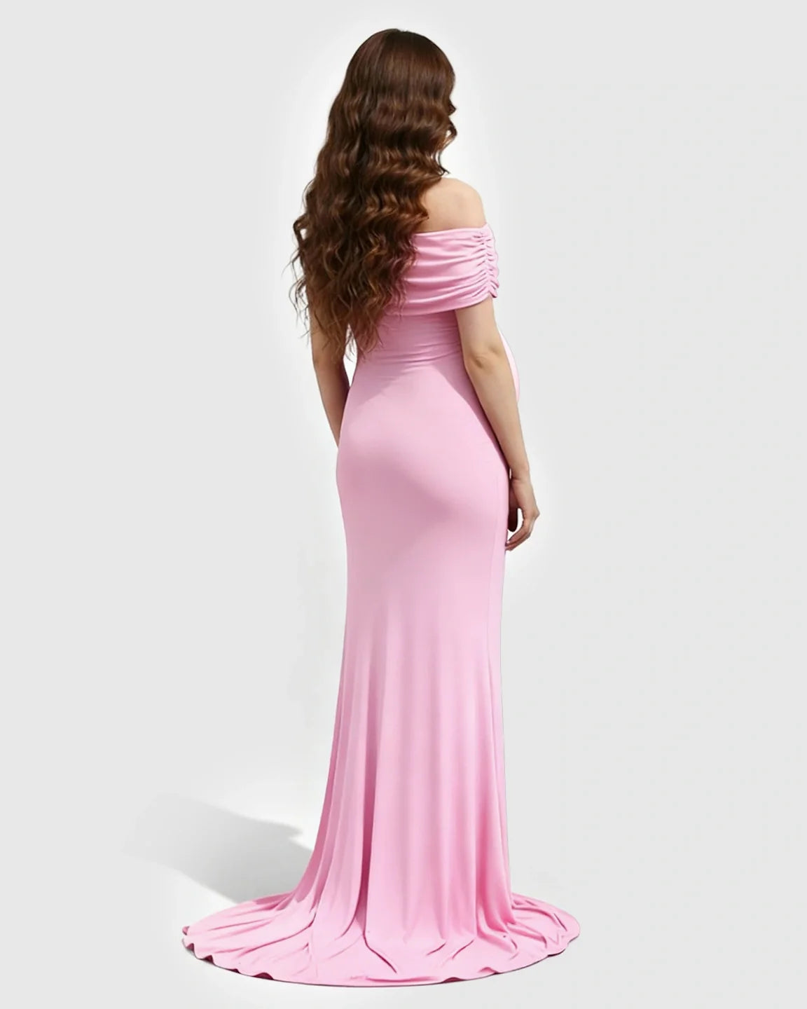 Pink off-shoulder bodycon maternity mermaid gown with long wavy hair, viewed from the back.