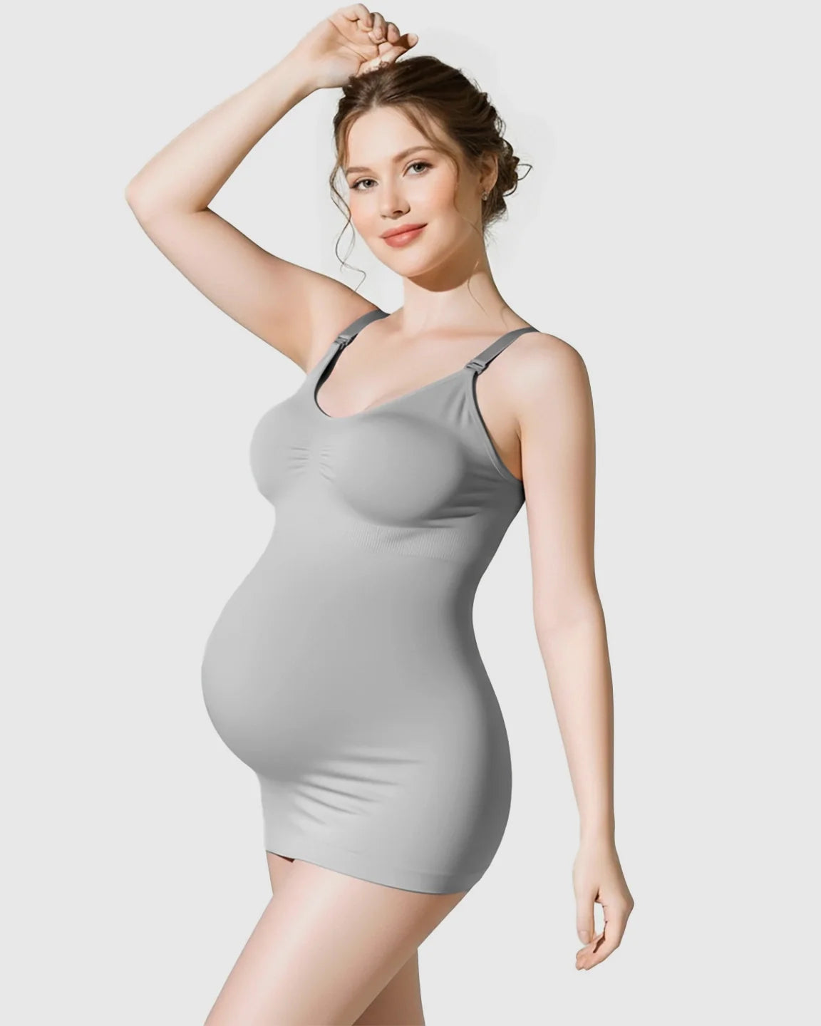 Pregnant woman wearing a gray soft stretch wireless maternity nursing camisole with front-opening straps.