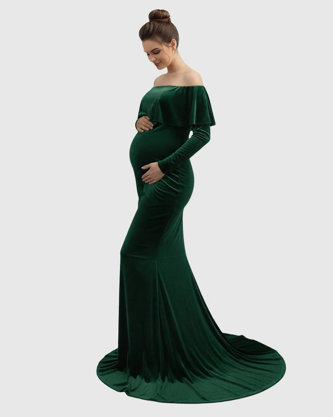 Elegant emerald green velvet off-shoulder maternity gown with a fitted silhouette and flowing train.