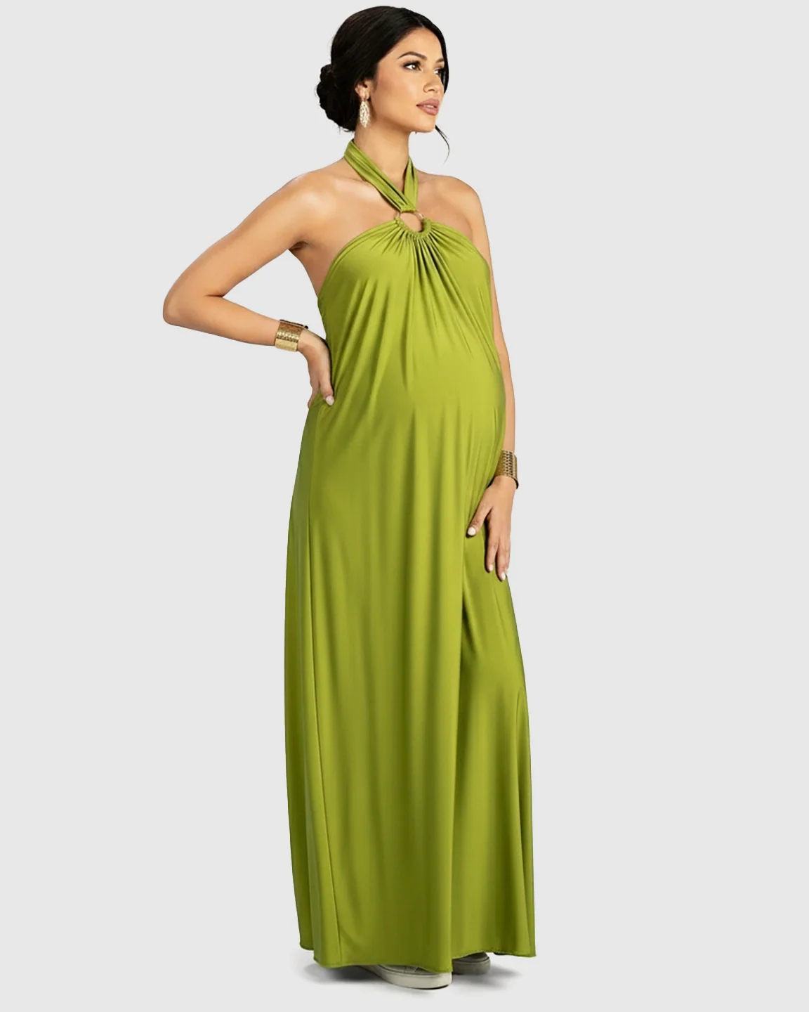 Green backless halter neck chiffon maternity maxi dress with a flowing skirt.