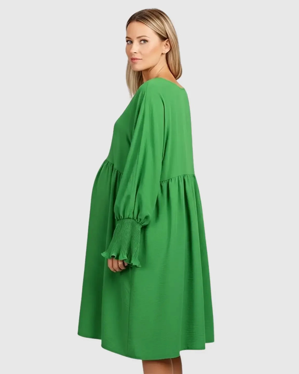 Green smocked sleeve maternity dress with a relaxed fit, round neckline, and three-quarter sleeves.
