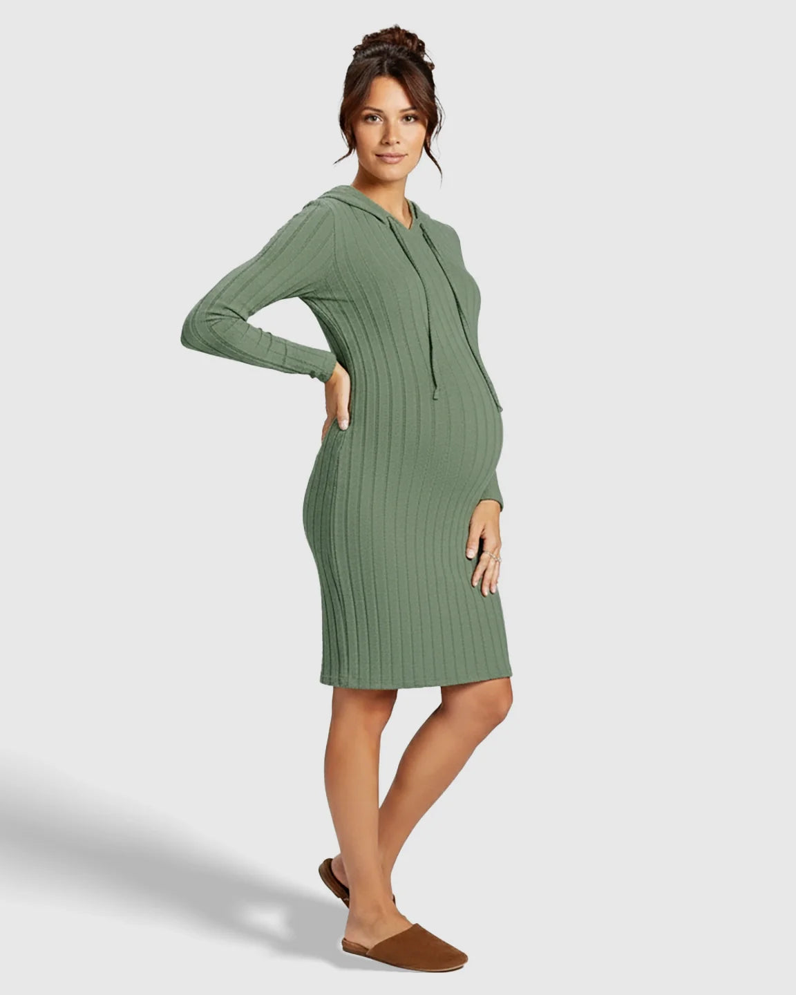 Pregnant woman in a green ribbed bodycon hooded maternity midi dress with long sleeves and drawstring.