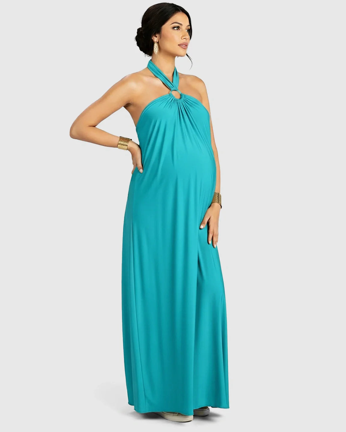 Turquoise backless halter neck chiffon maternity maxi dress with a flowing skirt.